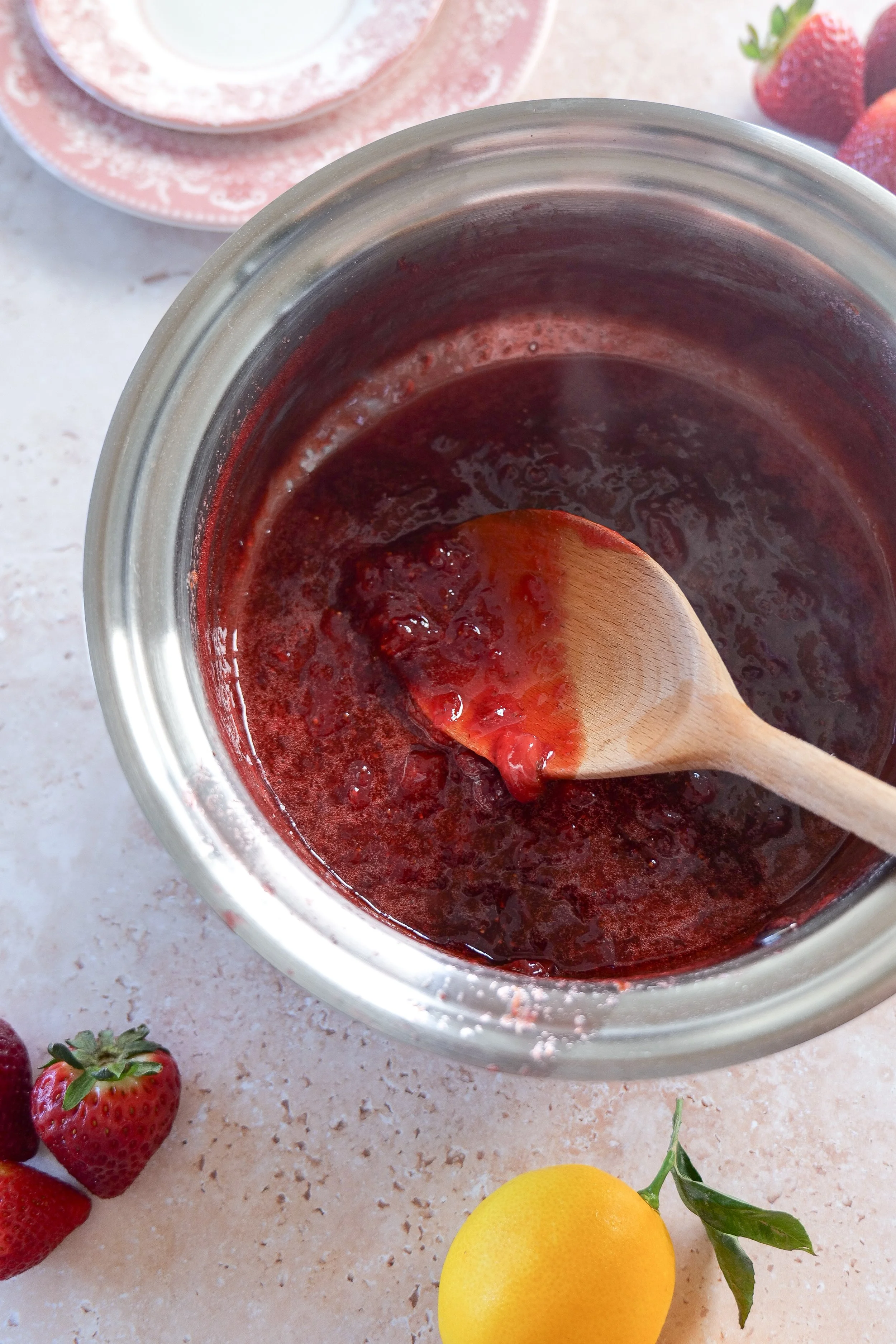 the process of making homemade strawberry sauce
