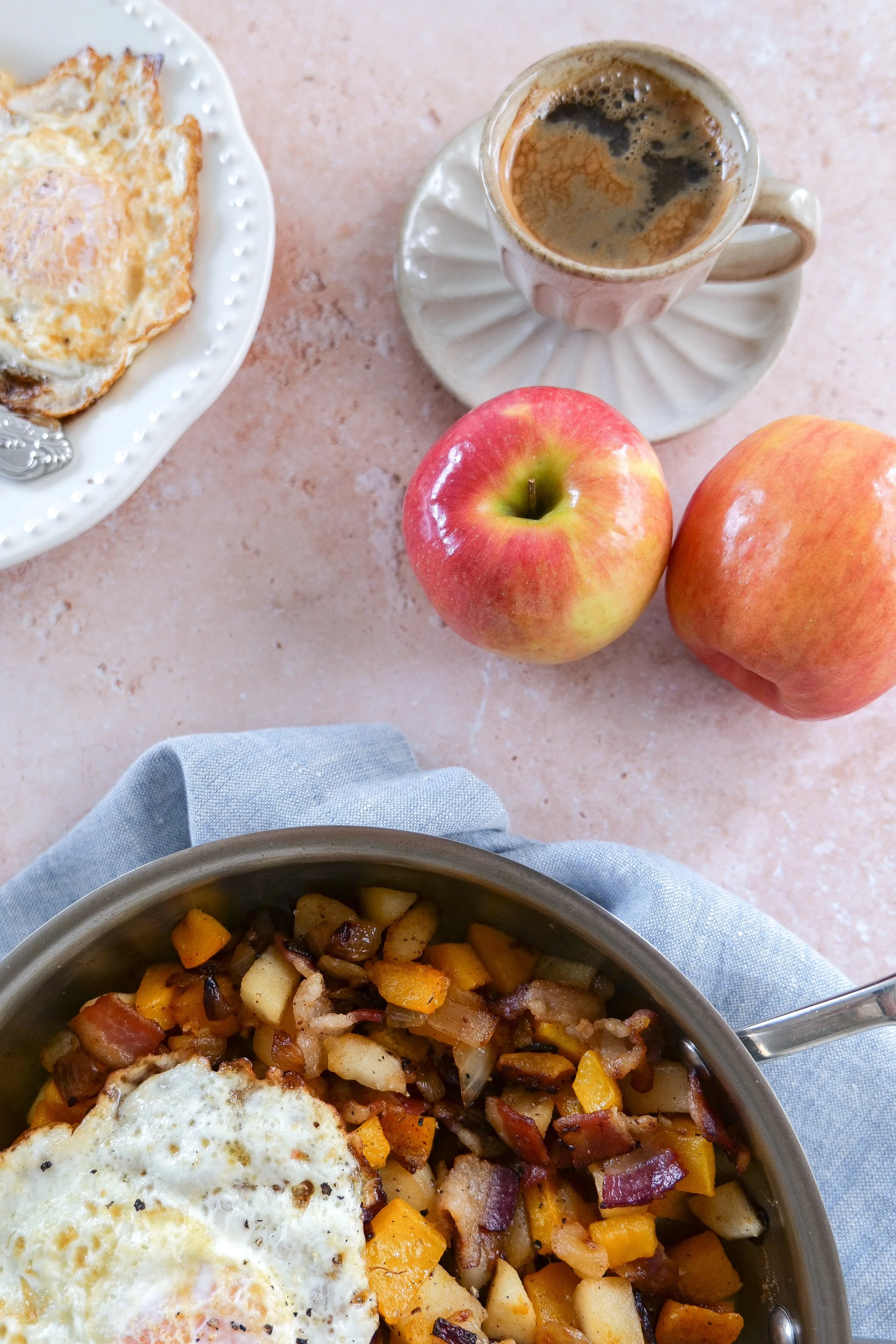 Cozy fall breakfast hash made with roasted butternut squash, apples, bacon, and eggs.
