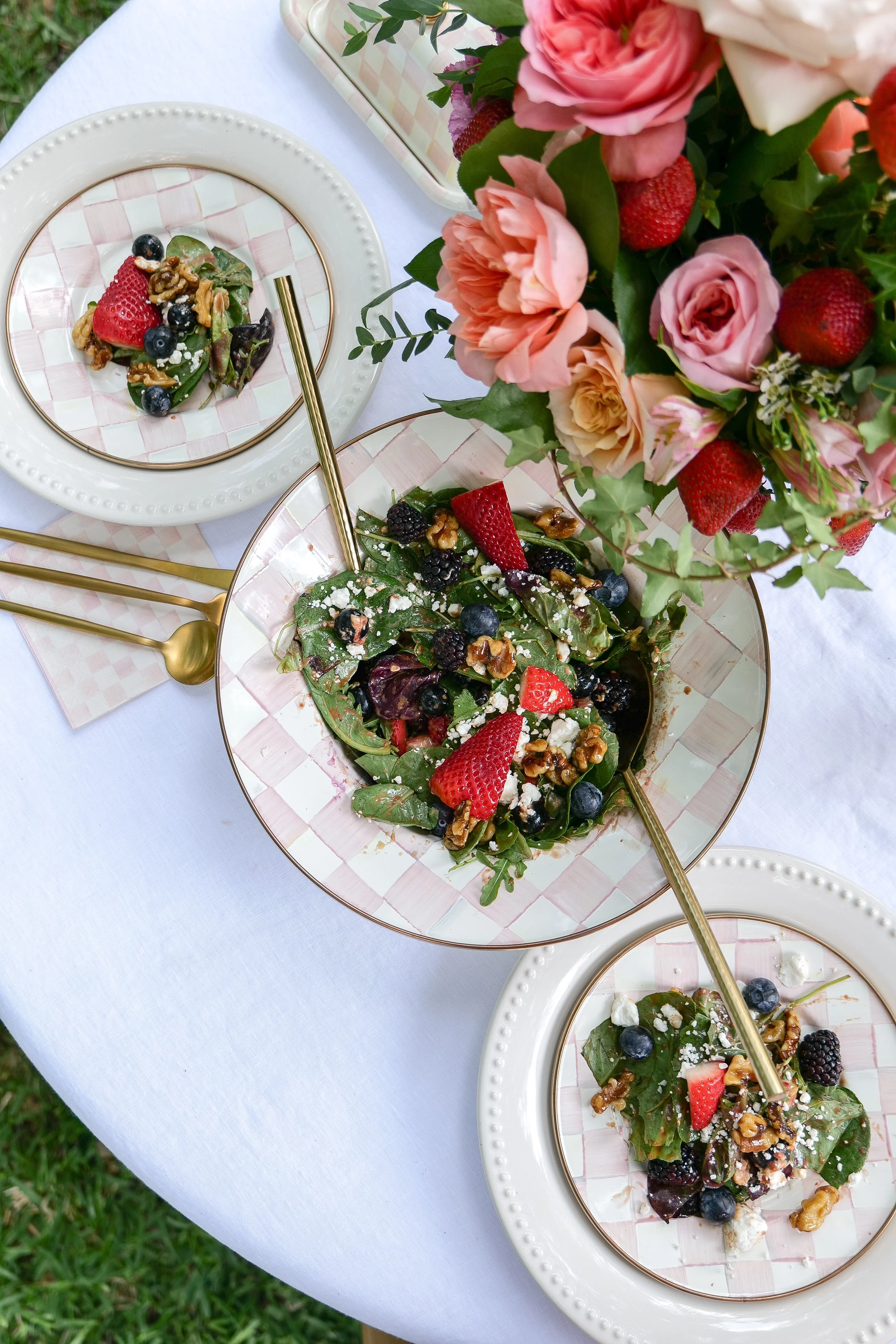 Fresh spinach salad with berries, creamy goat cheese and homemade maple candied walnuts.