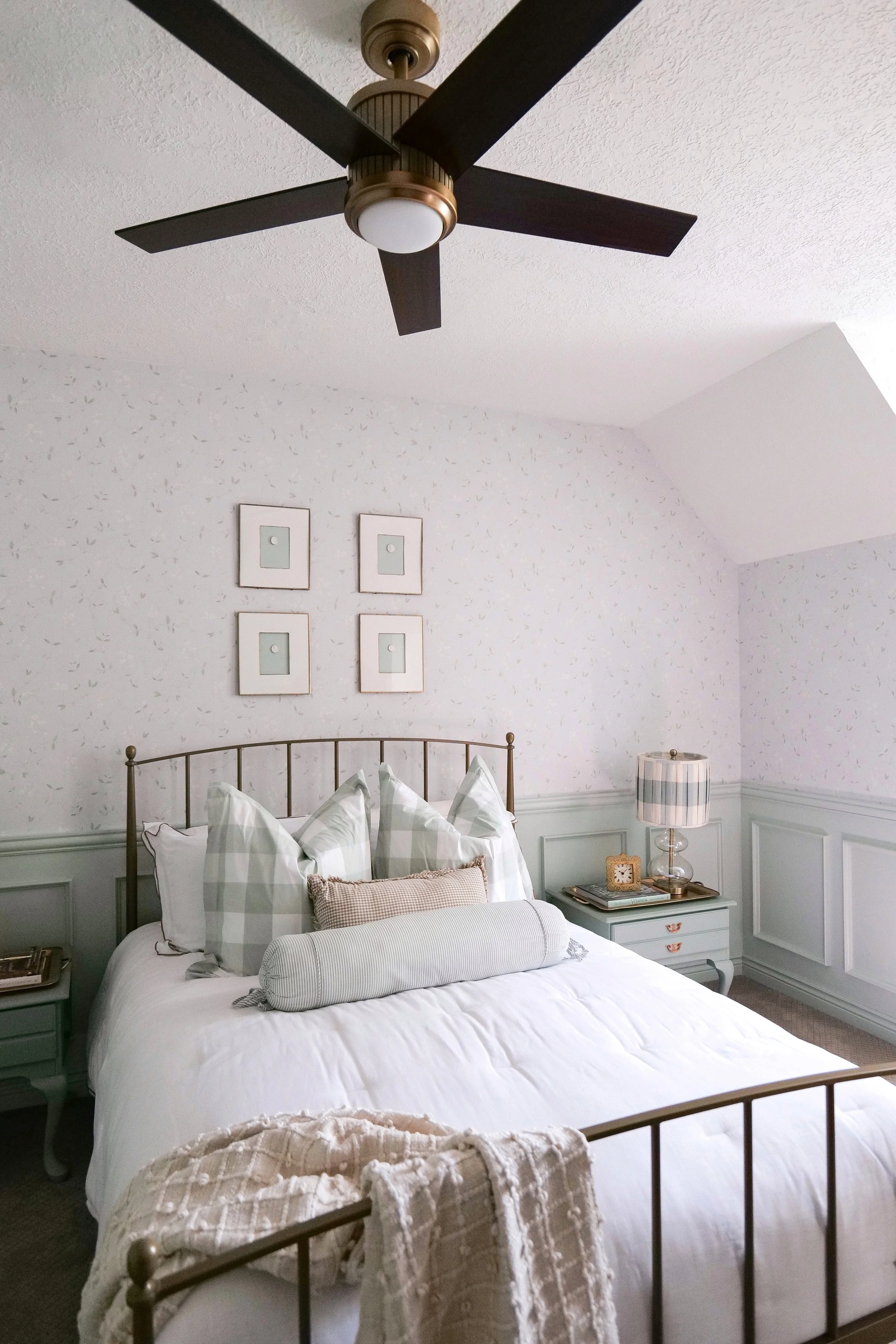 Full view of traditional blue guest bedroom showing elegant timeless styling.