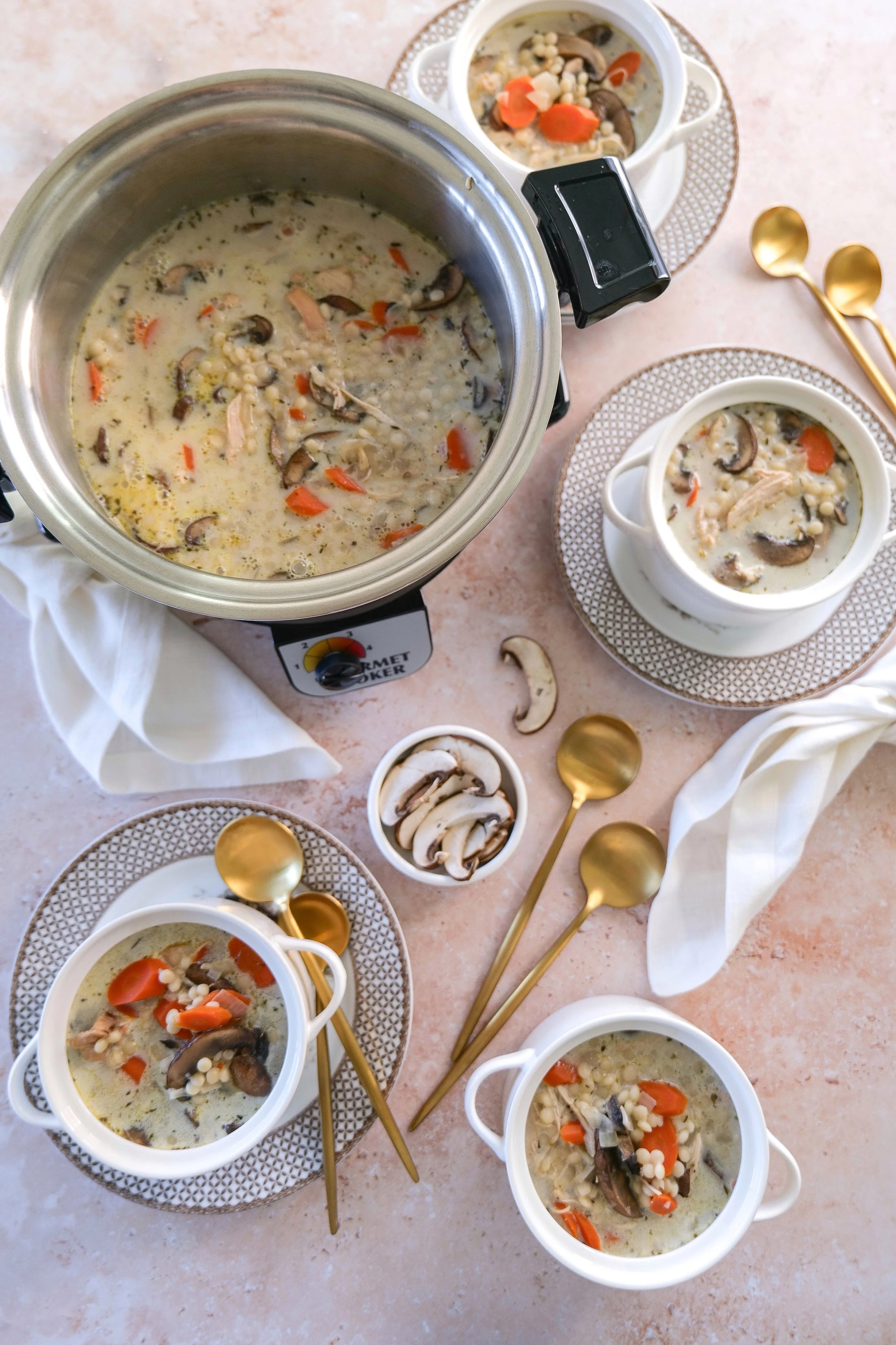 Homemade chicken mushroom couscous soup with vegetables in a creamy broth.