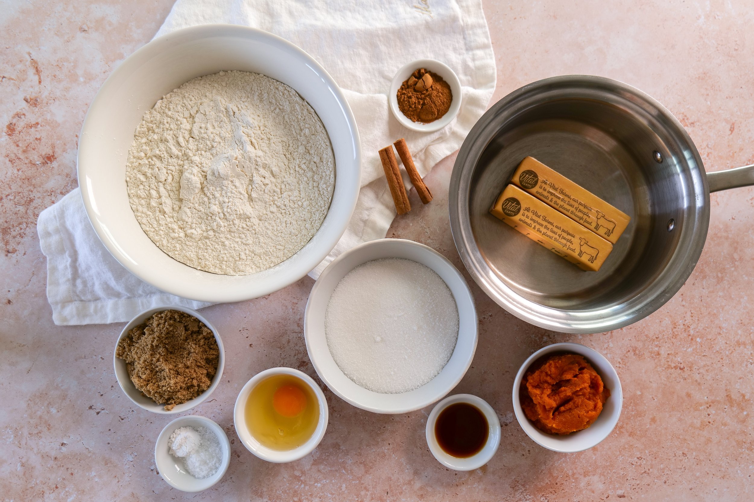 Ingredients for brown butter pumpkin sandwich cookies including pumpkin puree and fall spices