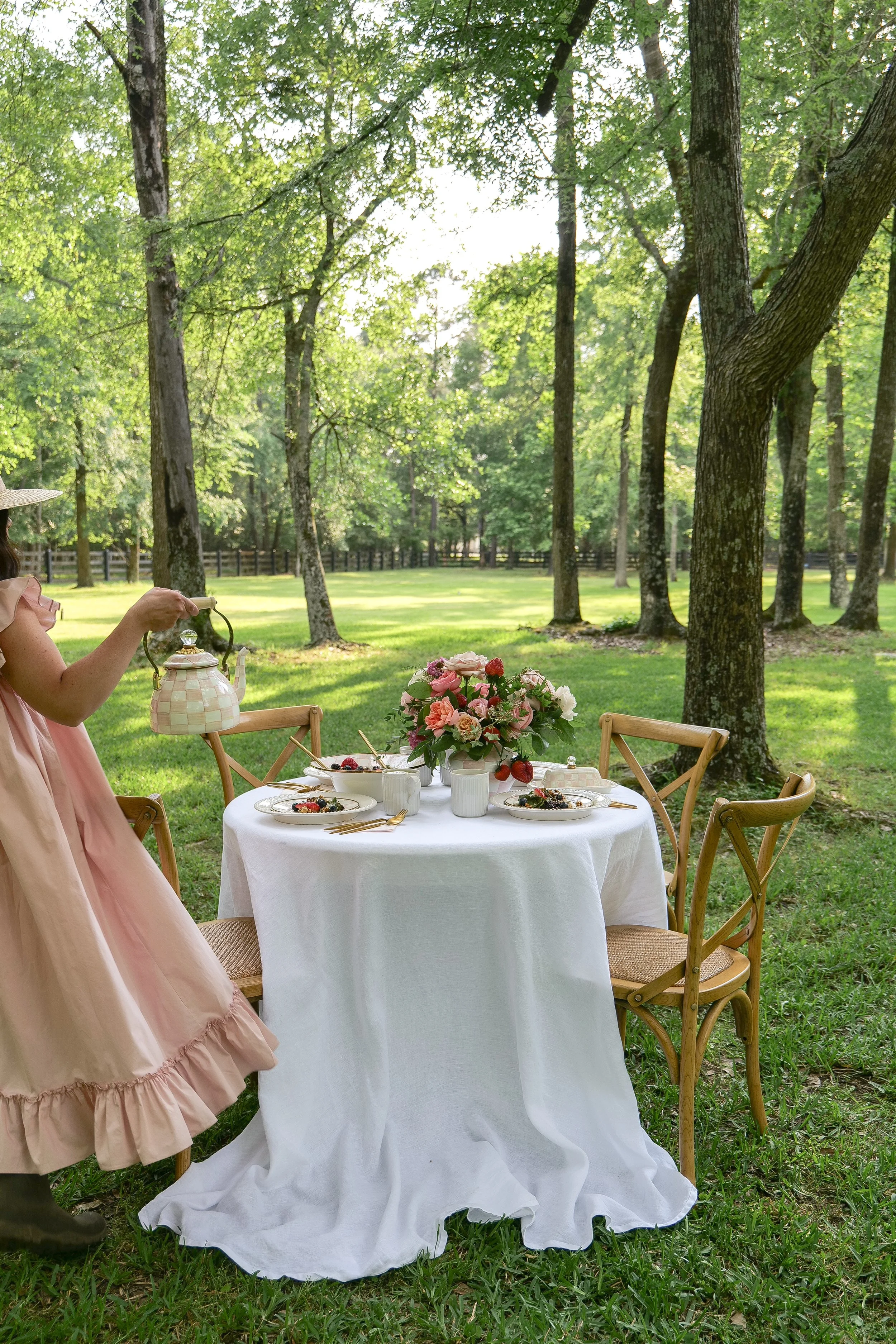 Pink garden party table setting with strawberries