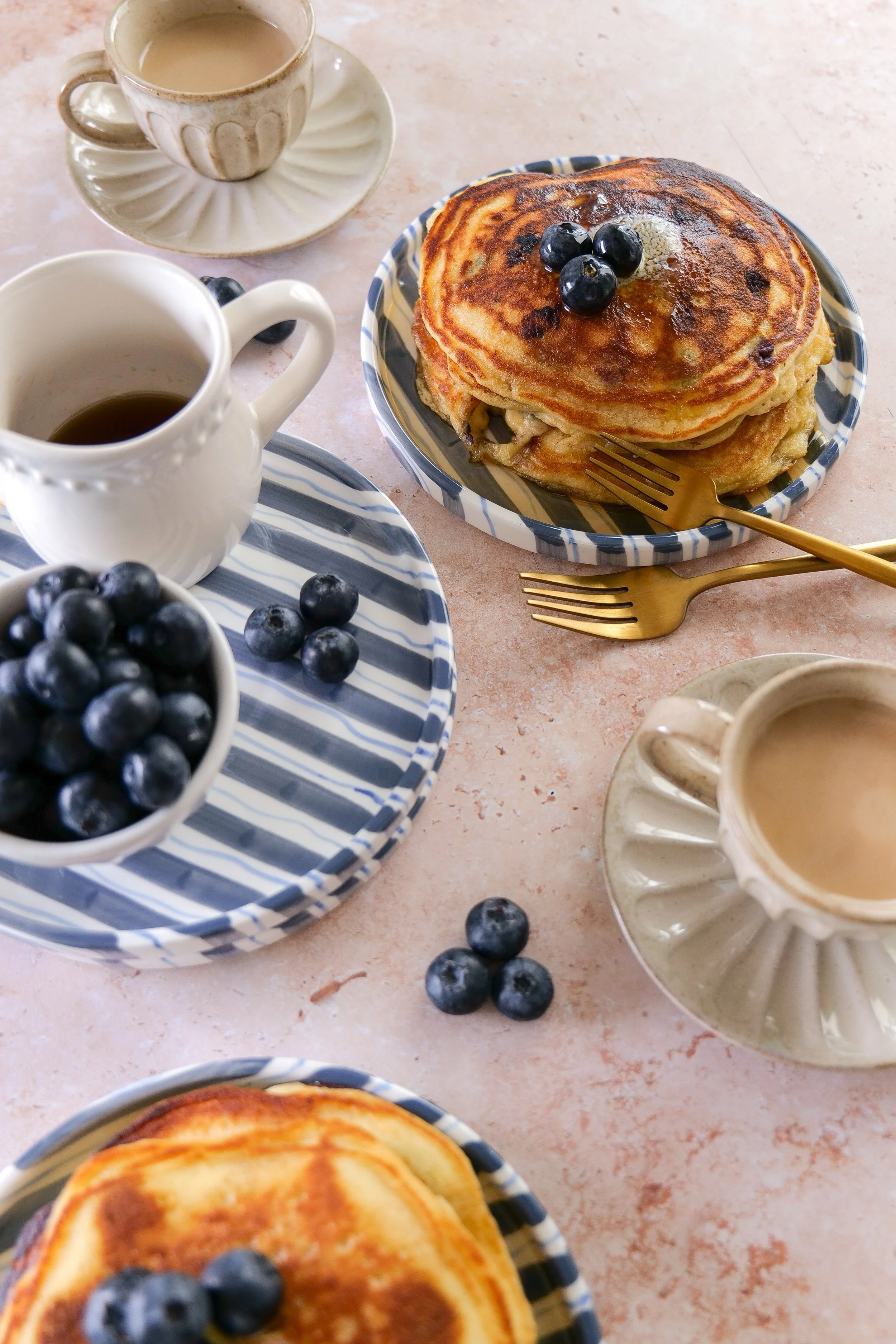 Golden brown sourdough discard pancakes filled with fresh blueberries