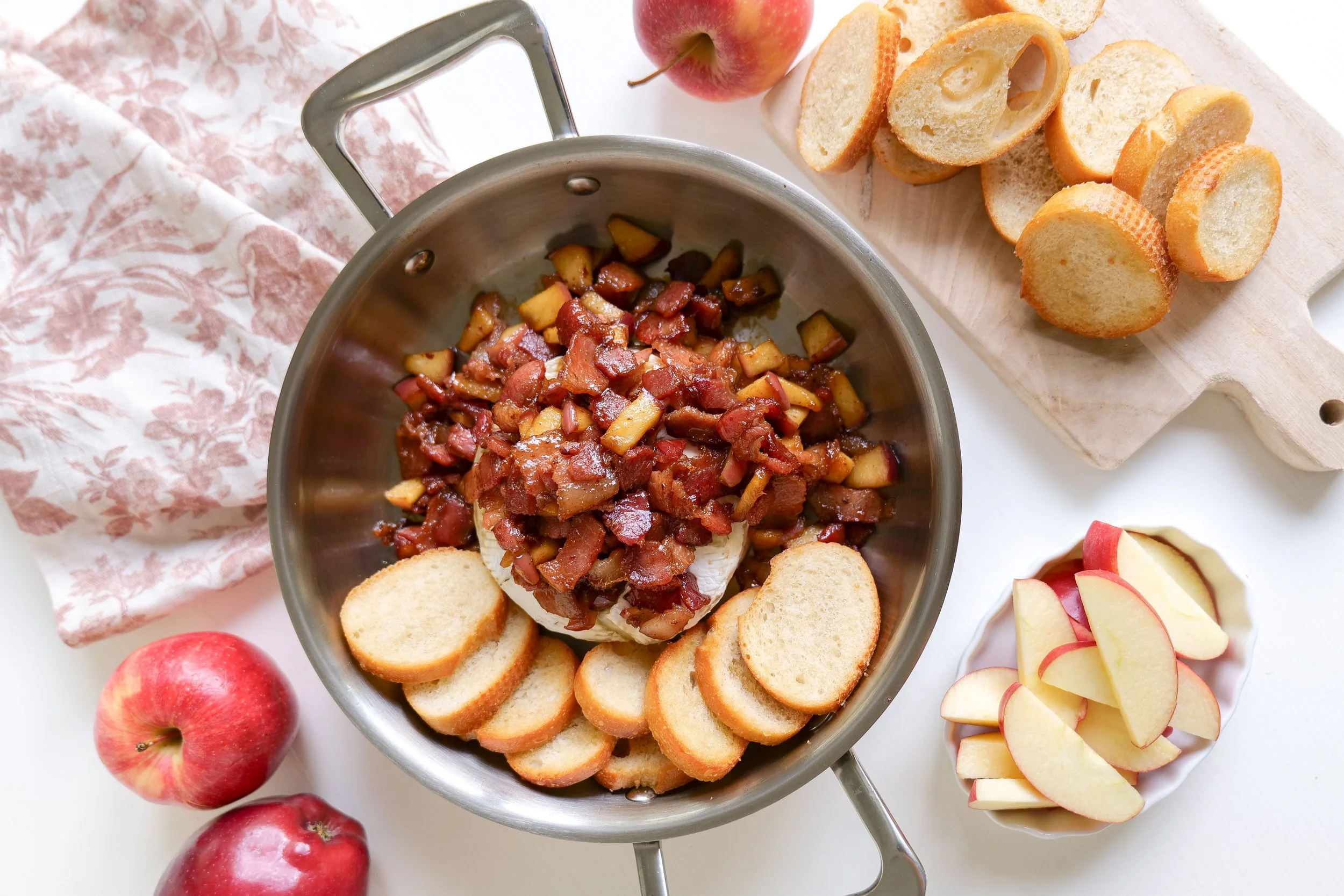 Creamy baked brie appetizer with bacon and apples for Thanksgiving and holiday entertaining.