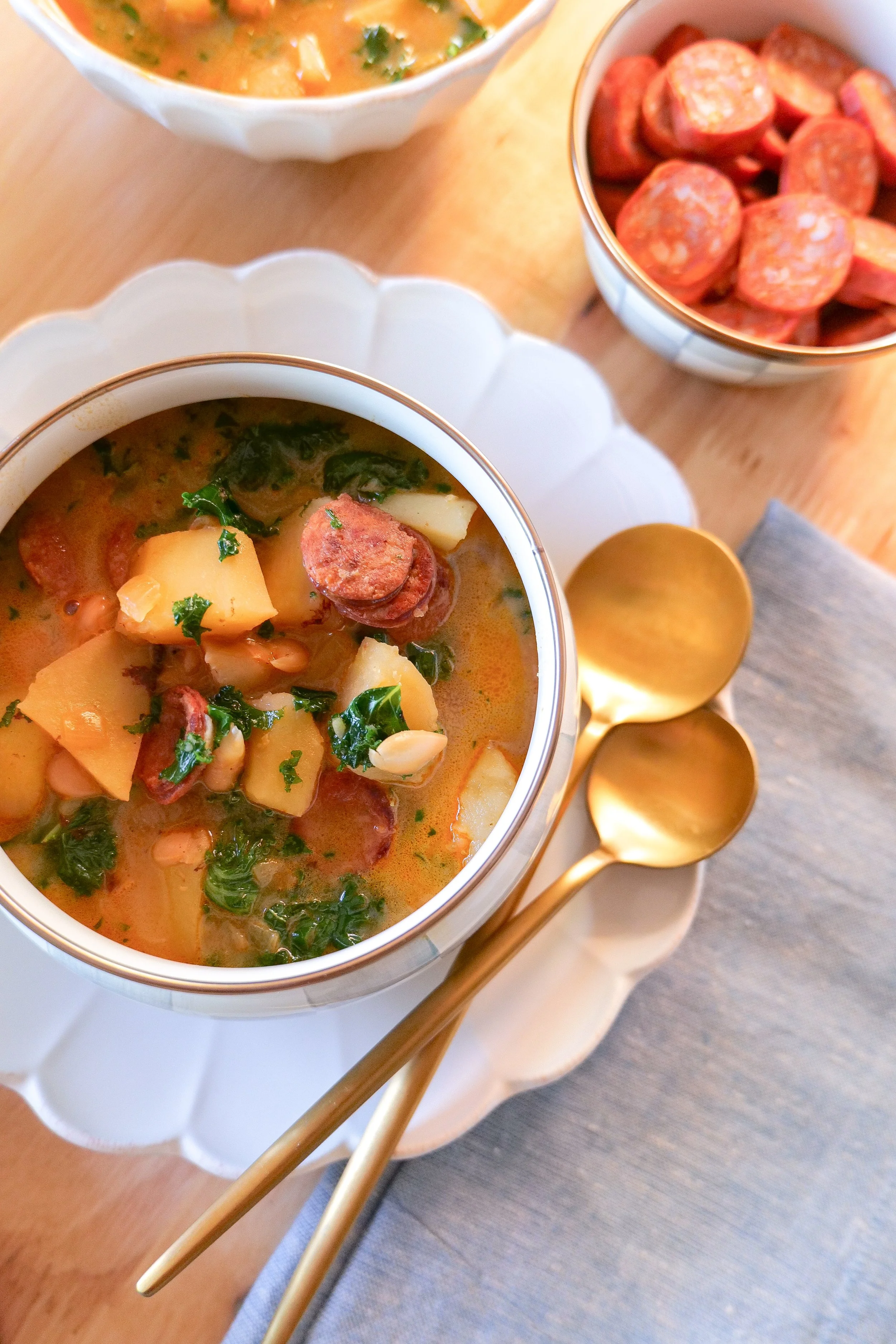 Homemade Portuguese linguiça soup served warm with kale, potatoes and beans.
