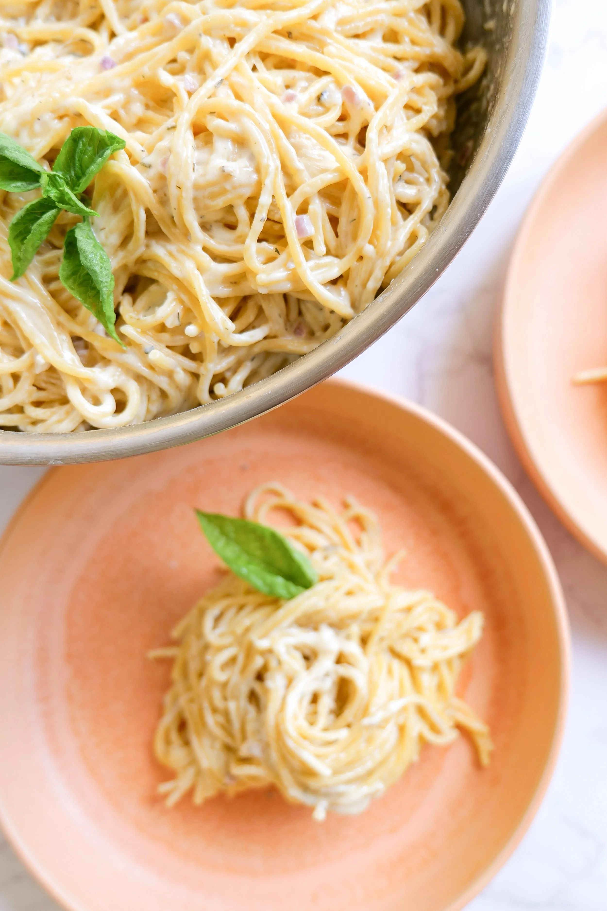 Pasta tossed in an easy homemade white sauce with Parmesan cheese.