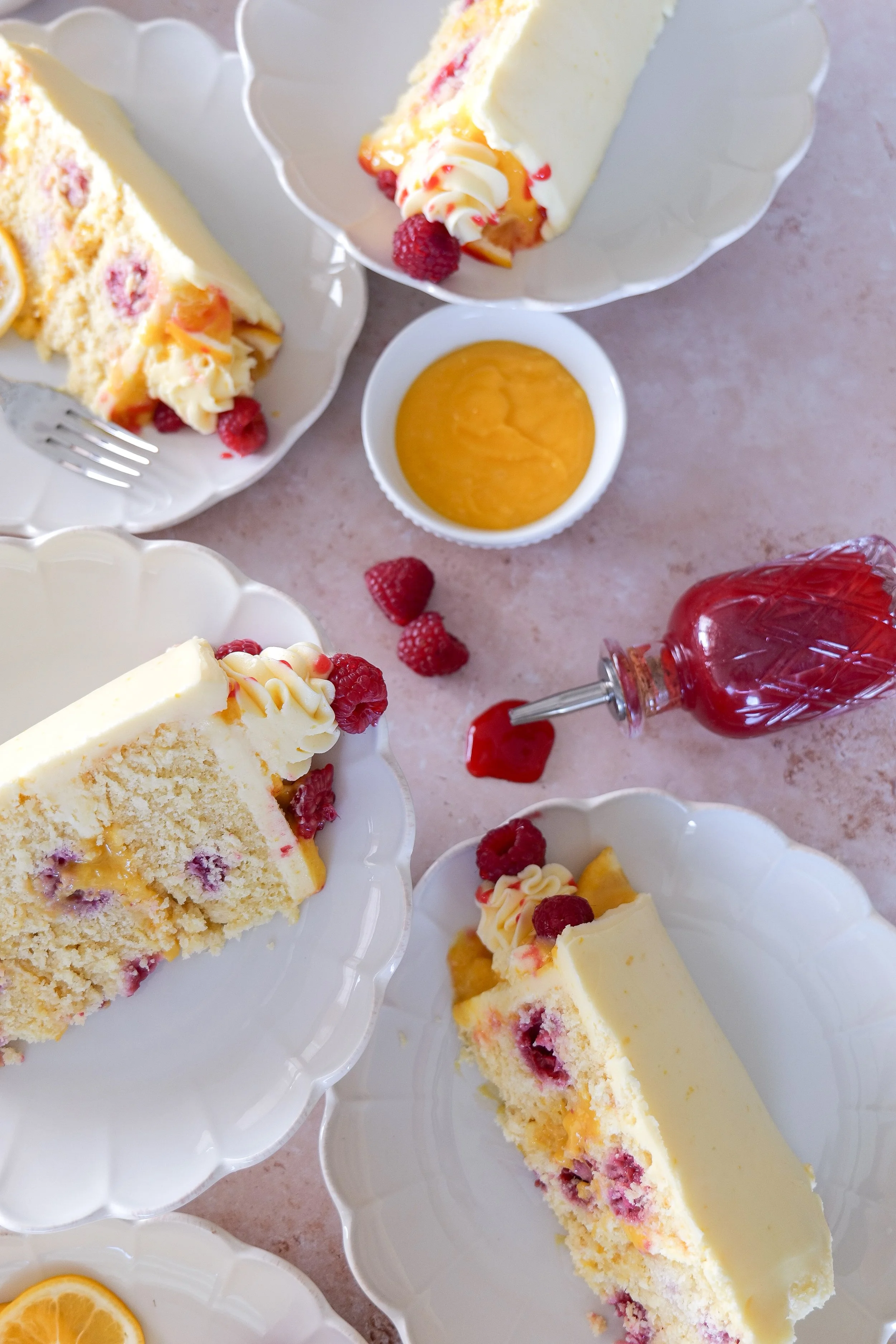 Homemade raspberry lemon cake with layered sponge and frosting.