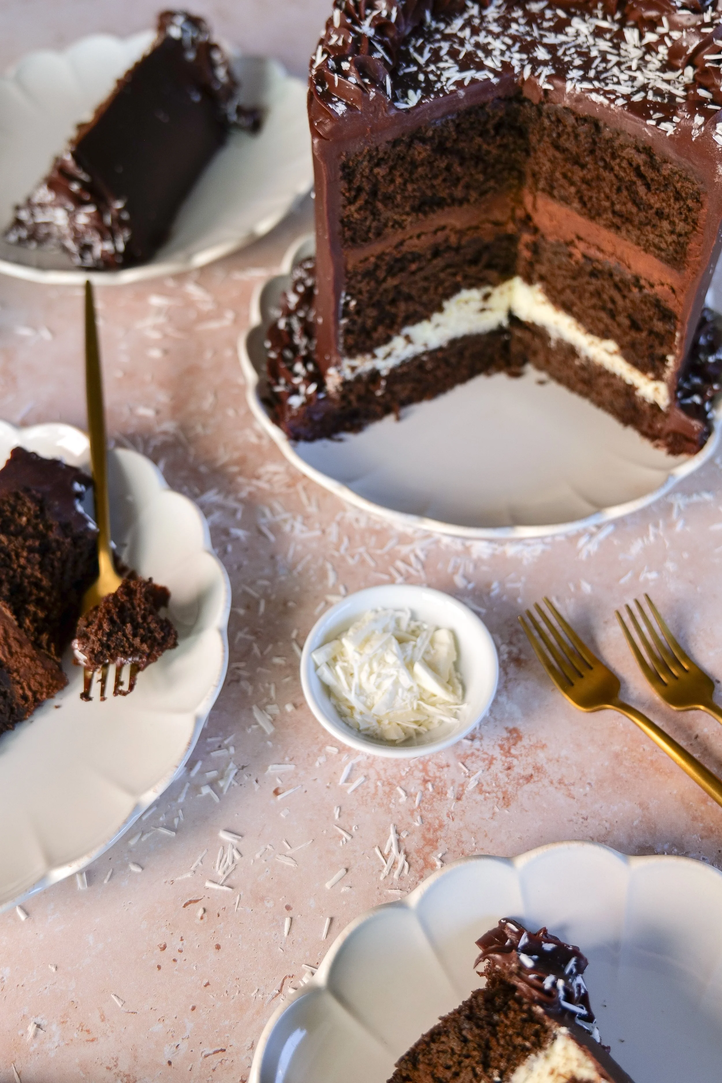 Layered chocolate mousse cake with contrasting dark cake and creamy white chocolate filling.