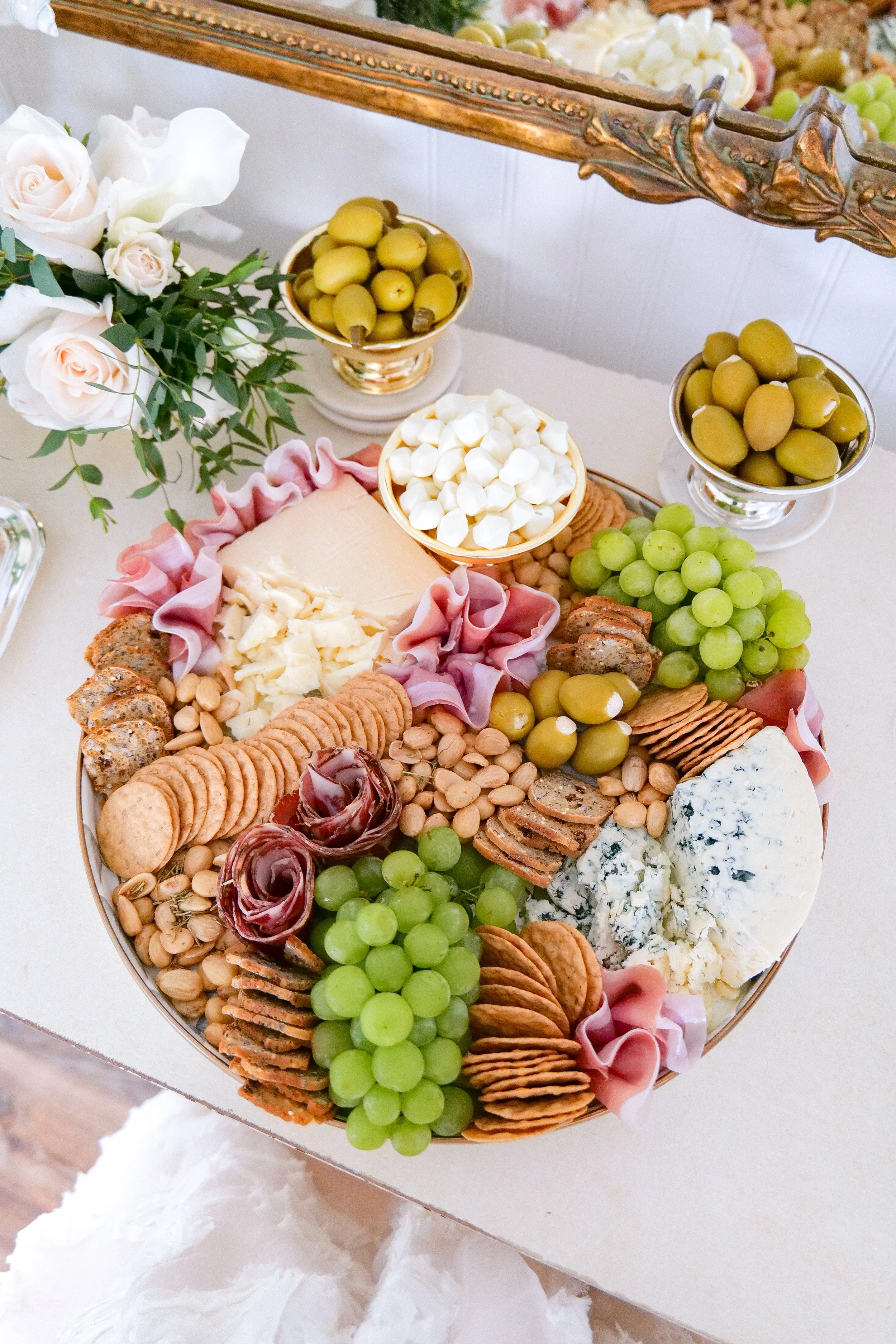 Summer grazing board filled with fruit, cheese, and crackers
