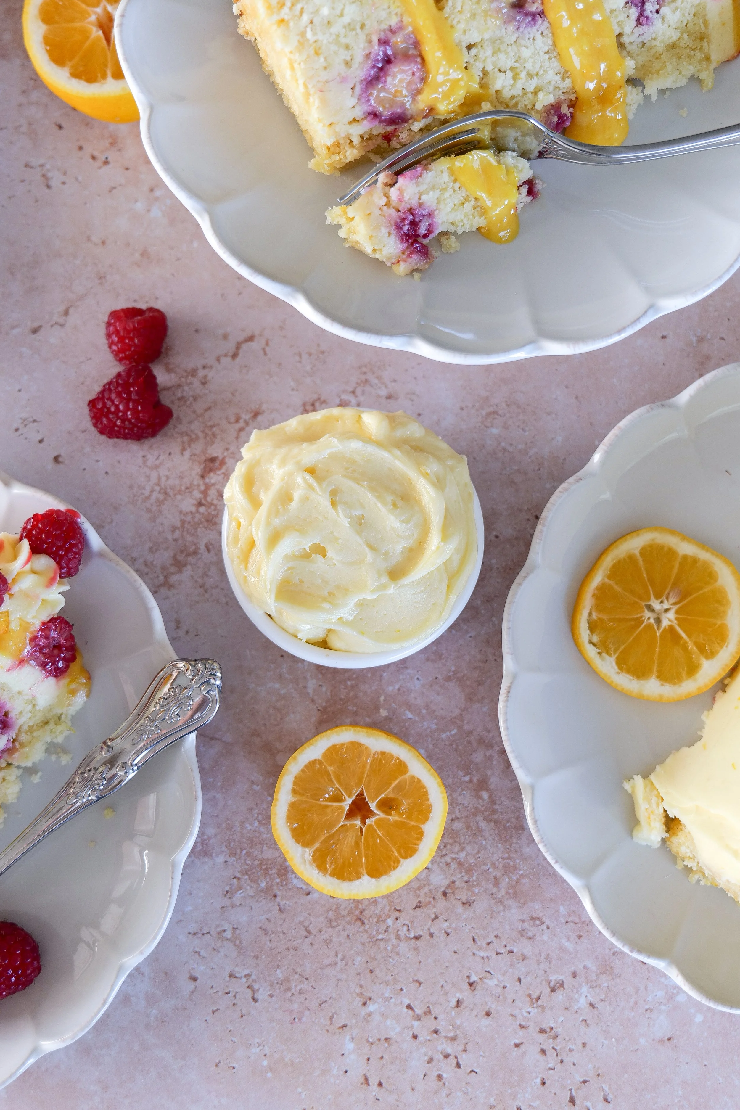 Lemon raspberry cake layered with lemon curd filling and fresh raspberries.