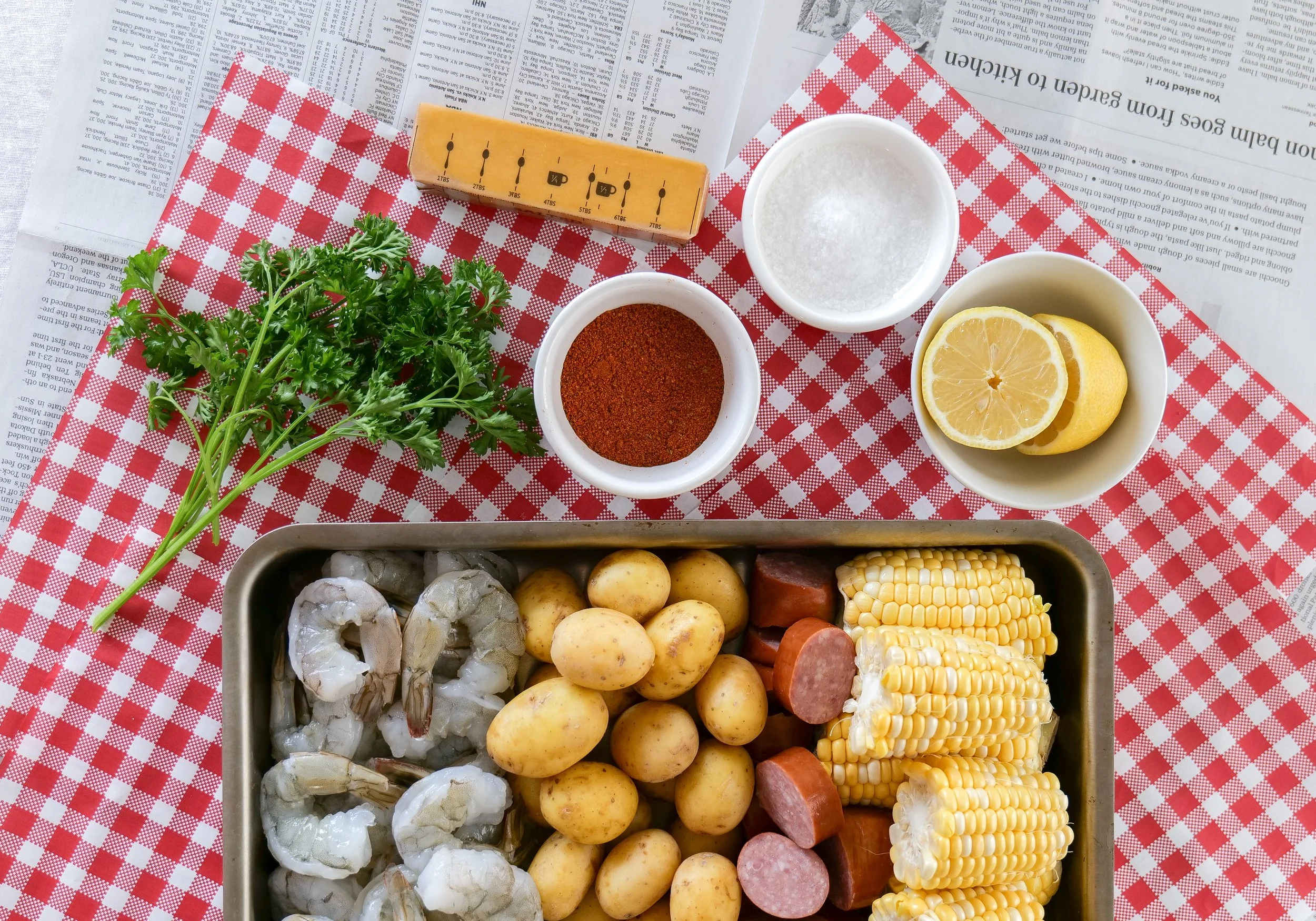 Shrimp boil served on a festive Americana-inspired summer tablescape.