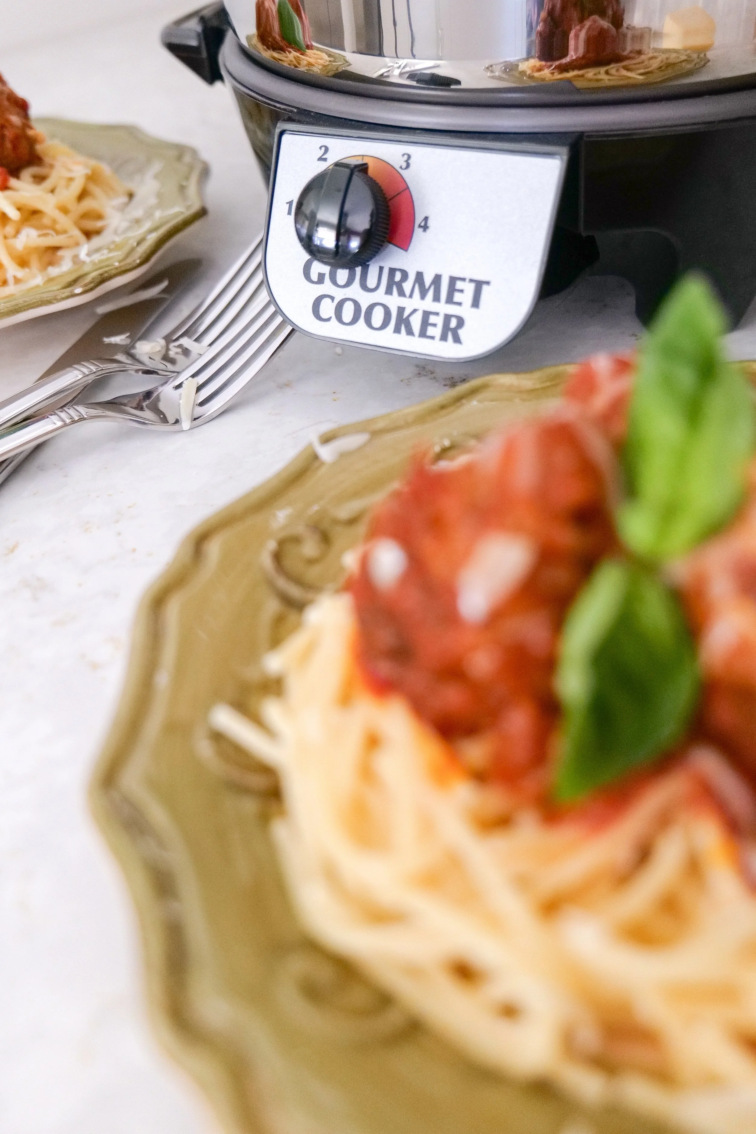 Homemade Italian meatballs in marinara sauce served over pasta