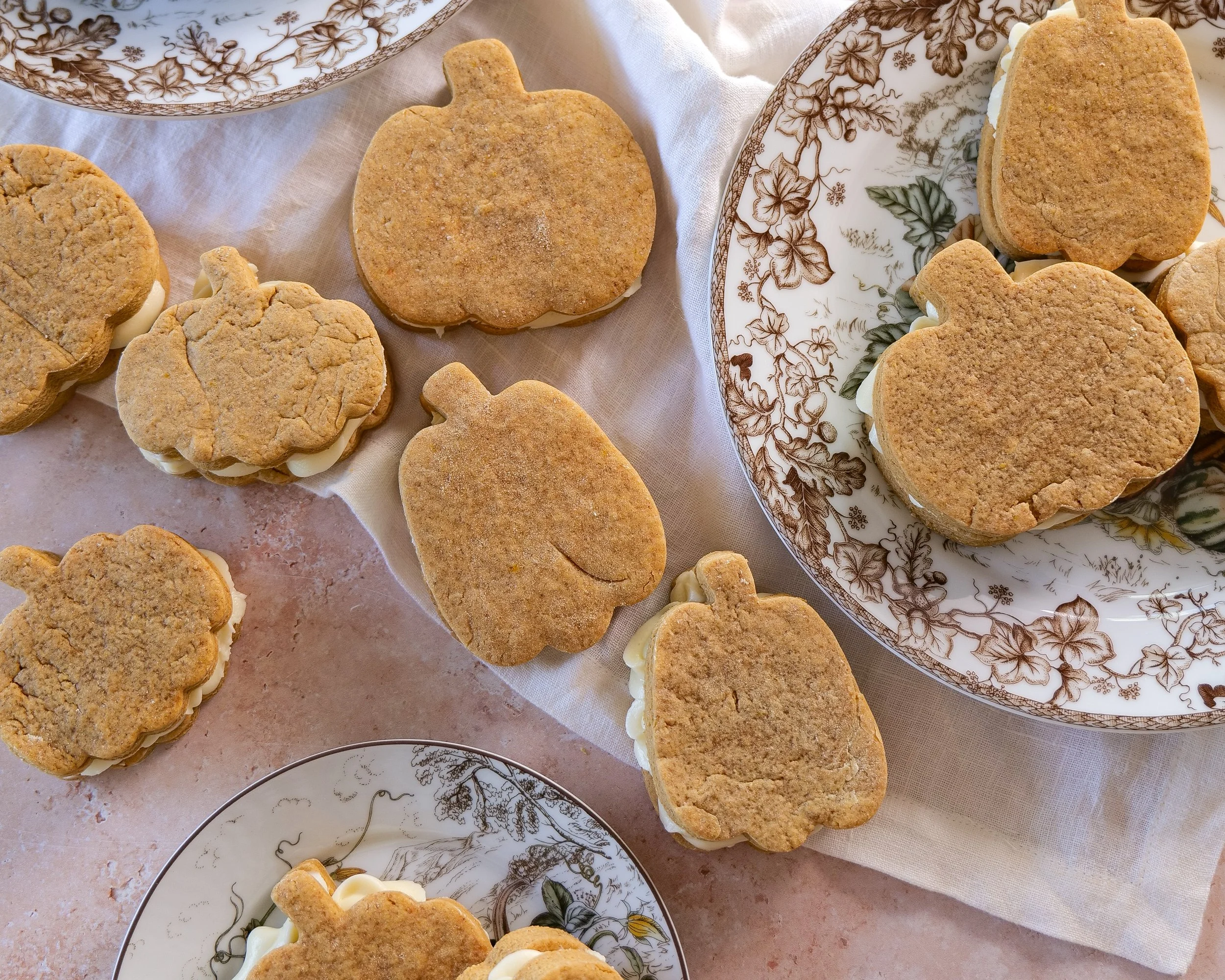 Soft pumpkin cutout cookie showing its baked texture and warm fall spices