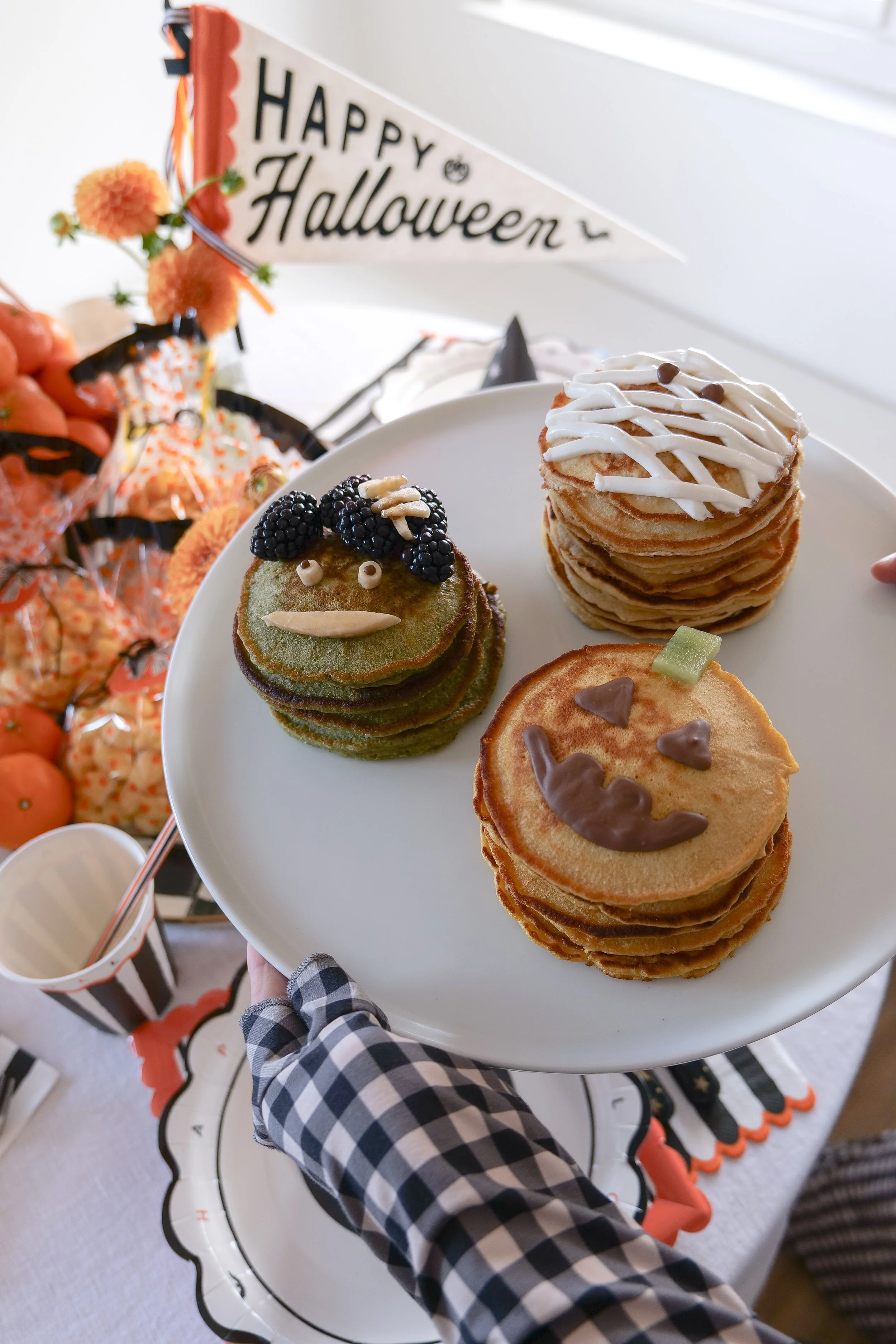 Fluffy sourdough discard Halloween pancakes decorated as three easy Halloween characters.
