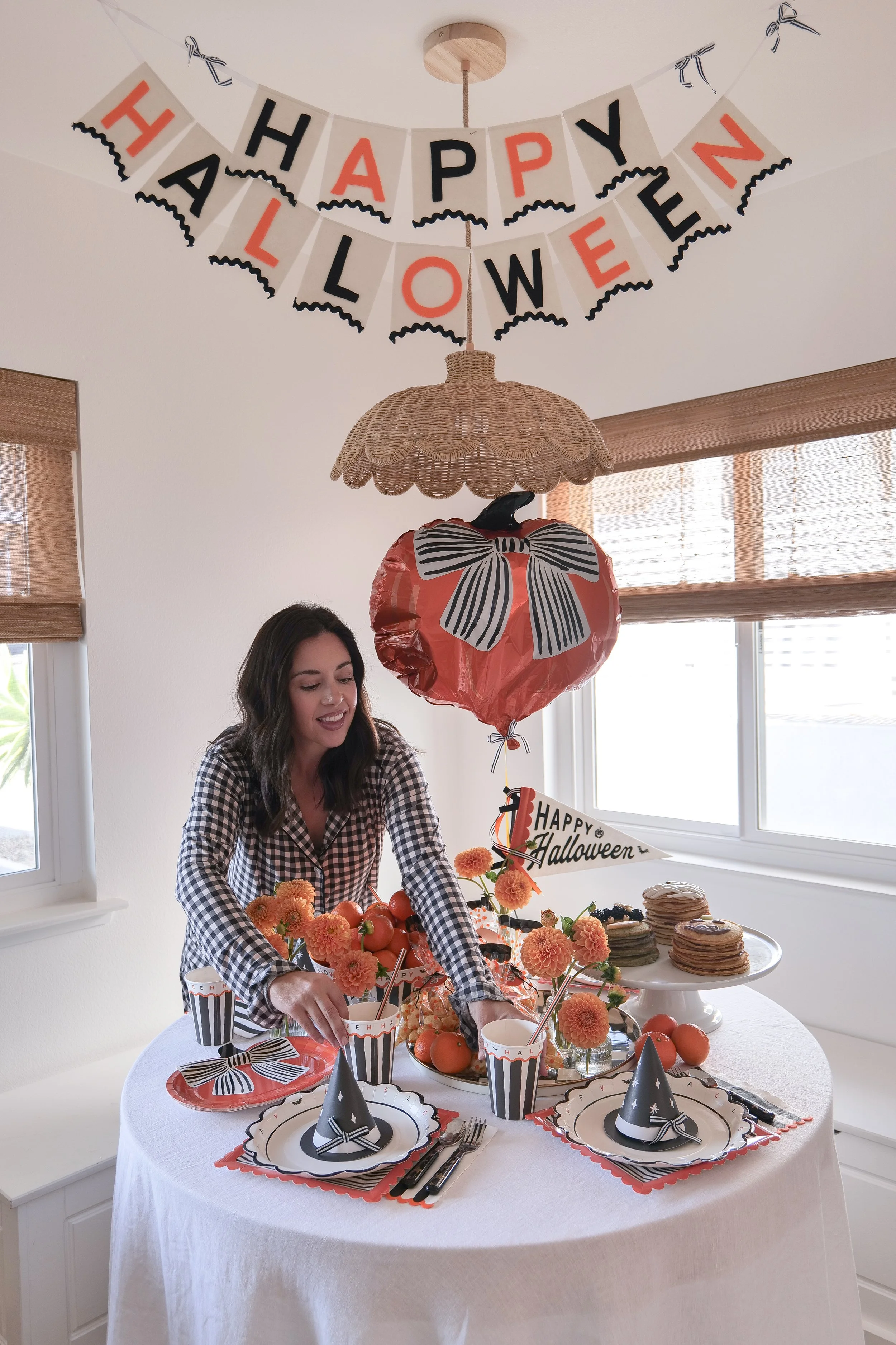 Simple Halloween breakfast for kids with festive pancakes and Halloween table decorations.