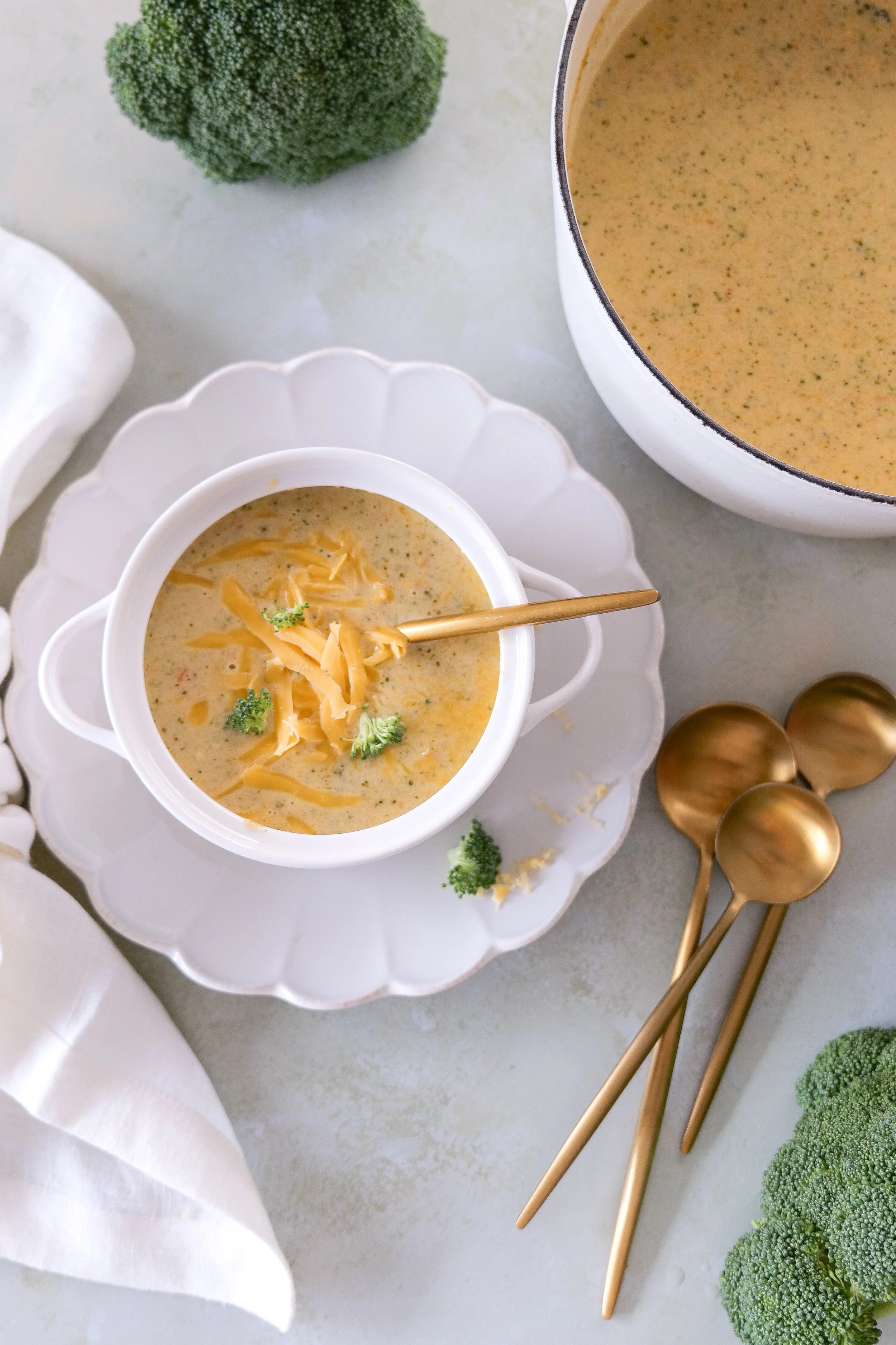 Creamy cheesy broccoli soup filled with broccoli florets and shredded carrots.