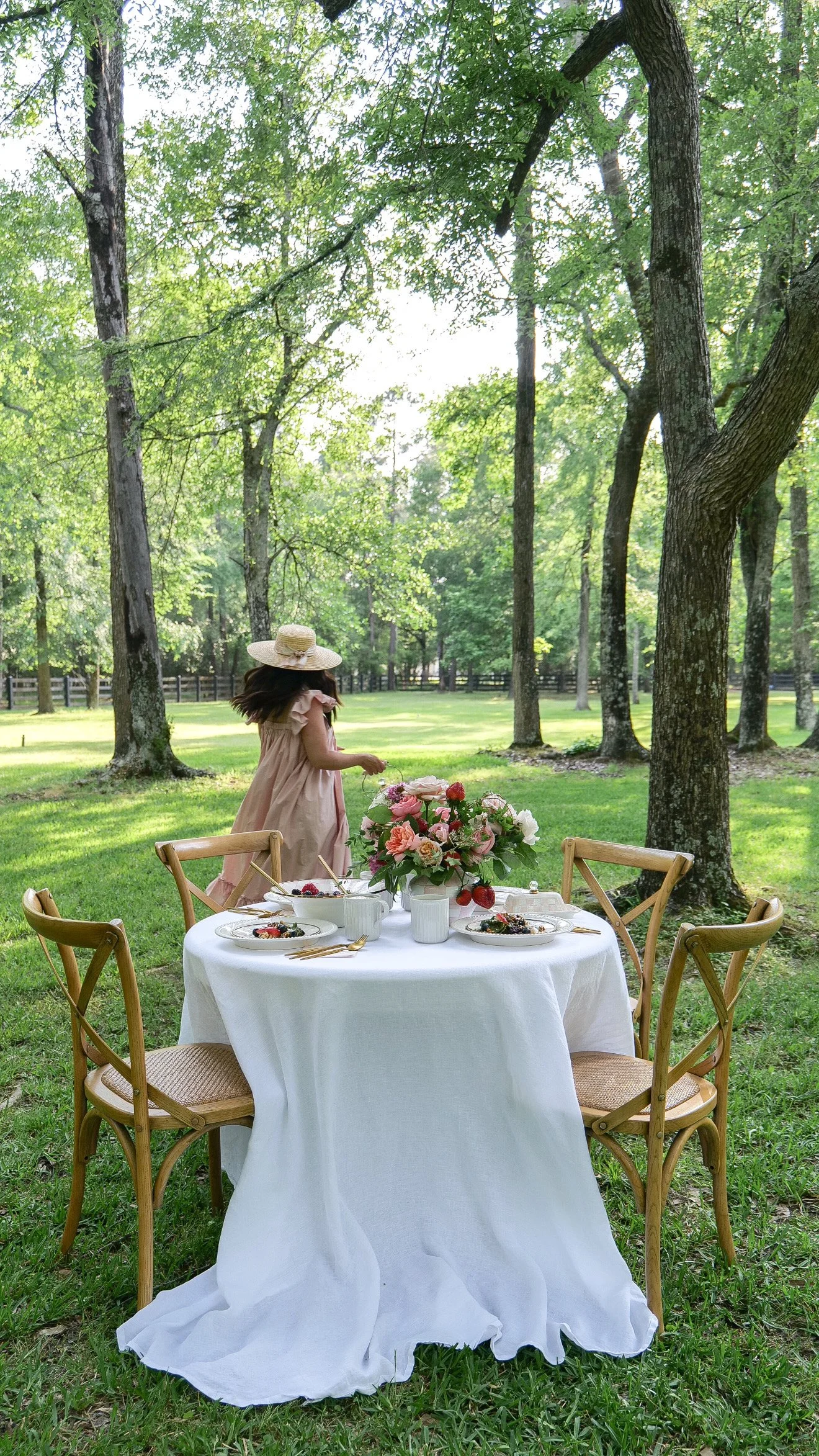 Woman walking away from a table decorated with seasonal fruits and vegetables