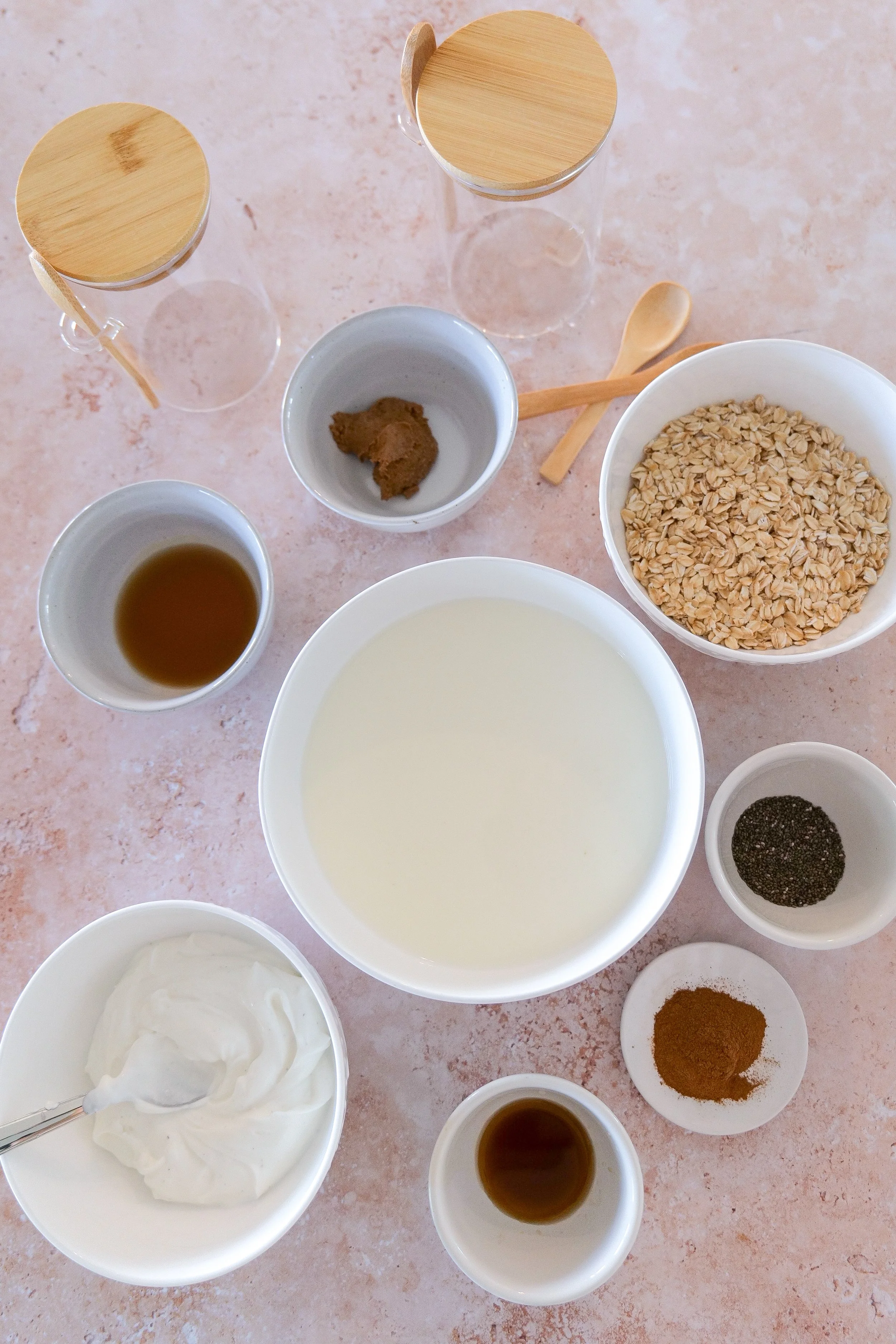 Ingredients for homemade apple pie overnight oats with apples, rolled oats, cinnamon, Greek yogurt and almond butter.