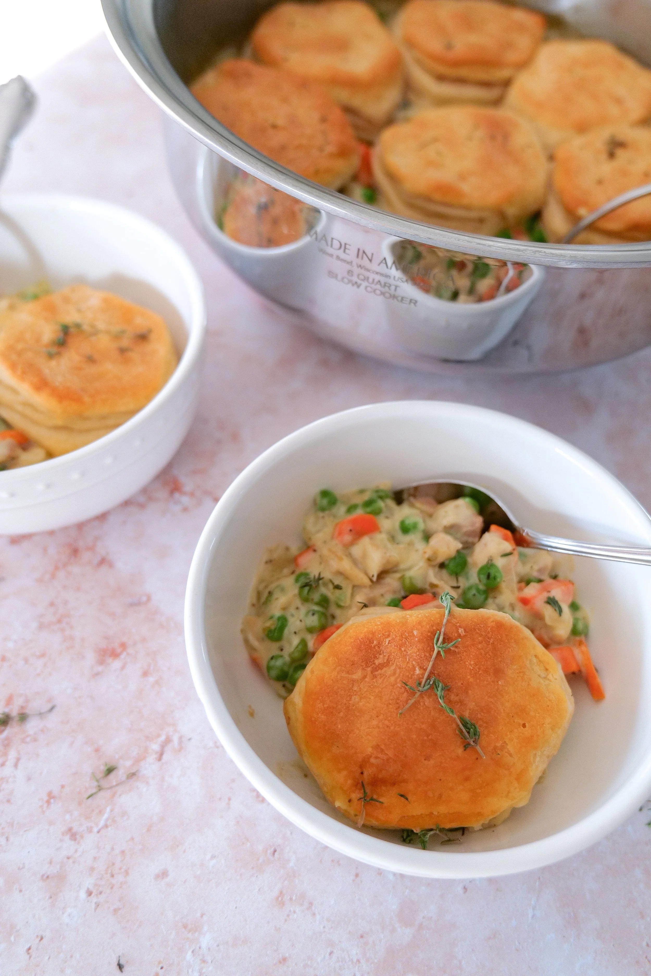 Homemade skillet chicken pot pie topped with buttery biscuits and served warm for a cozy family dinner.