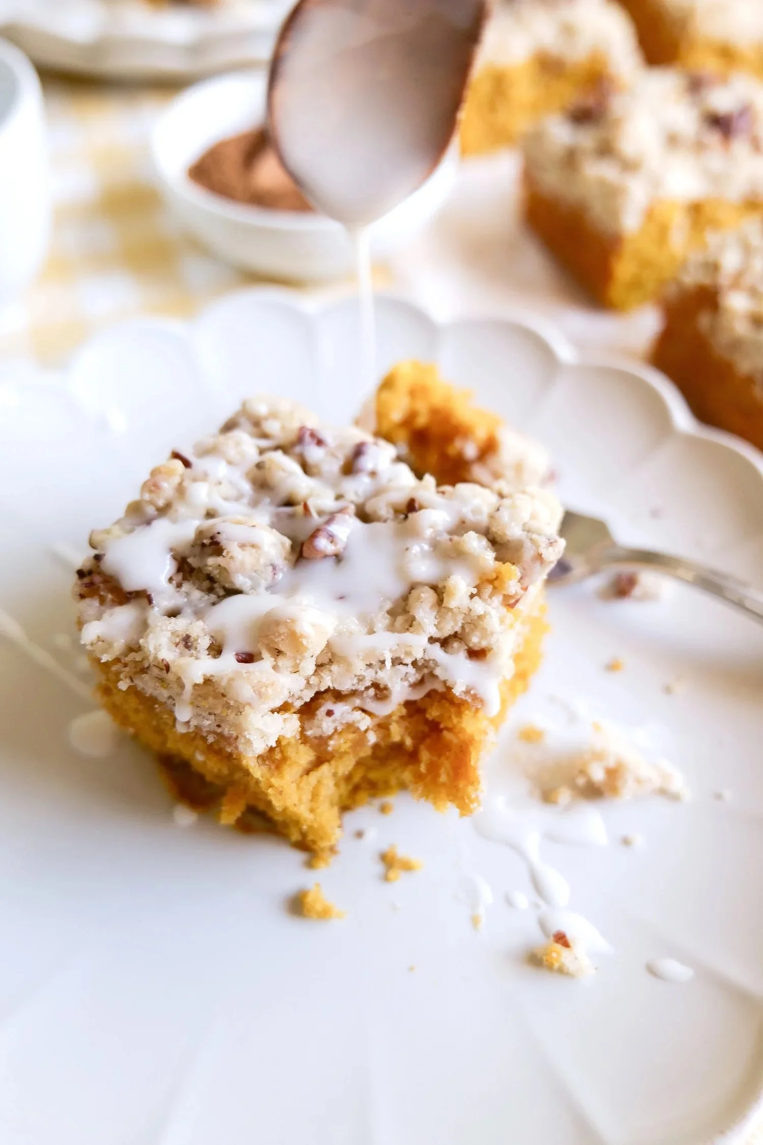 Moist pumpkin coffee cake topped with a buttery pecan crumble.