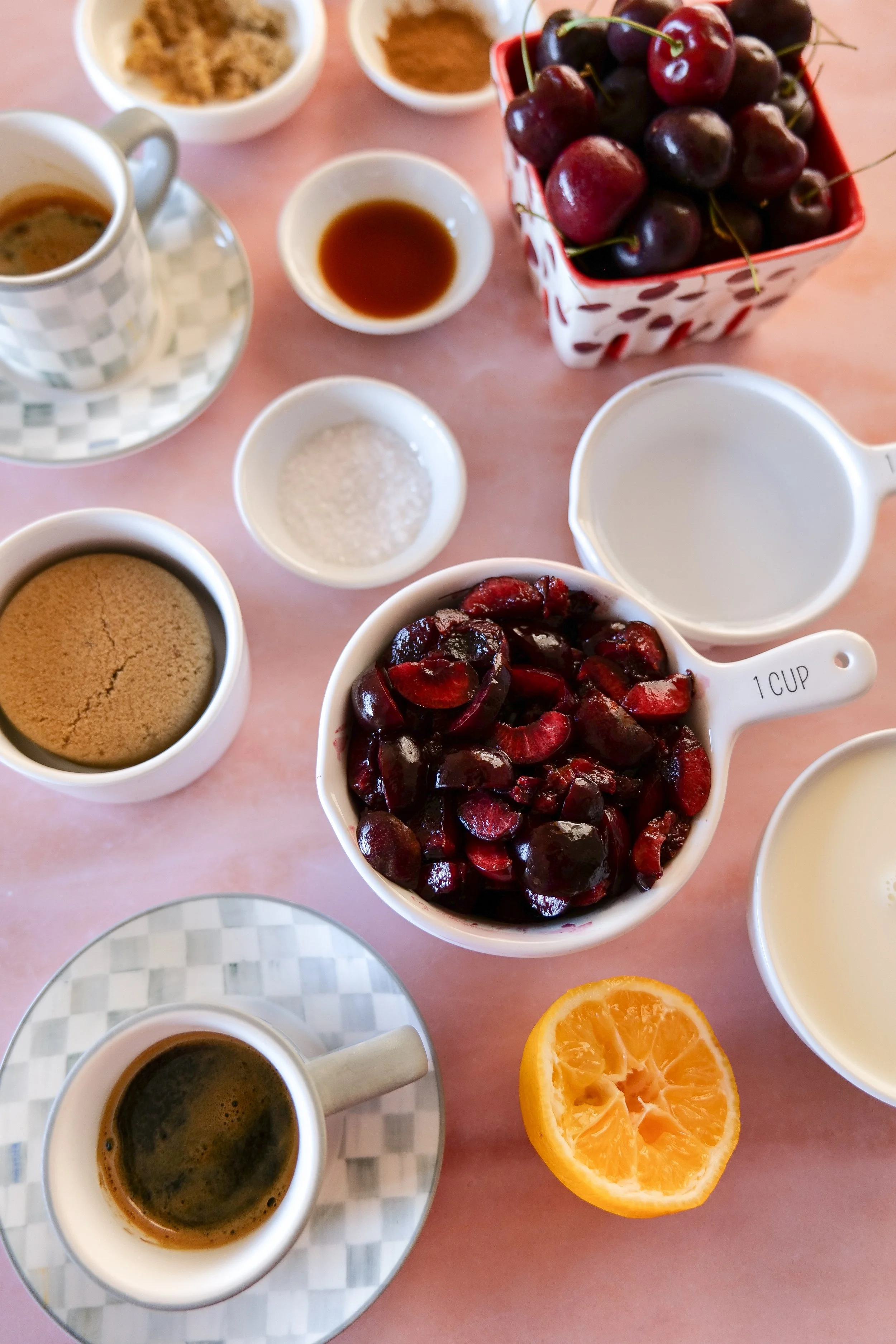 Creamy homemade iced latte topped with thick cold foam and fresh cherries.