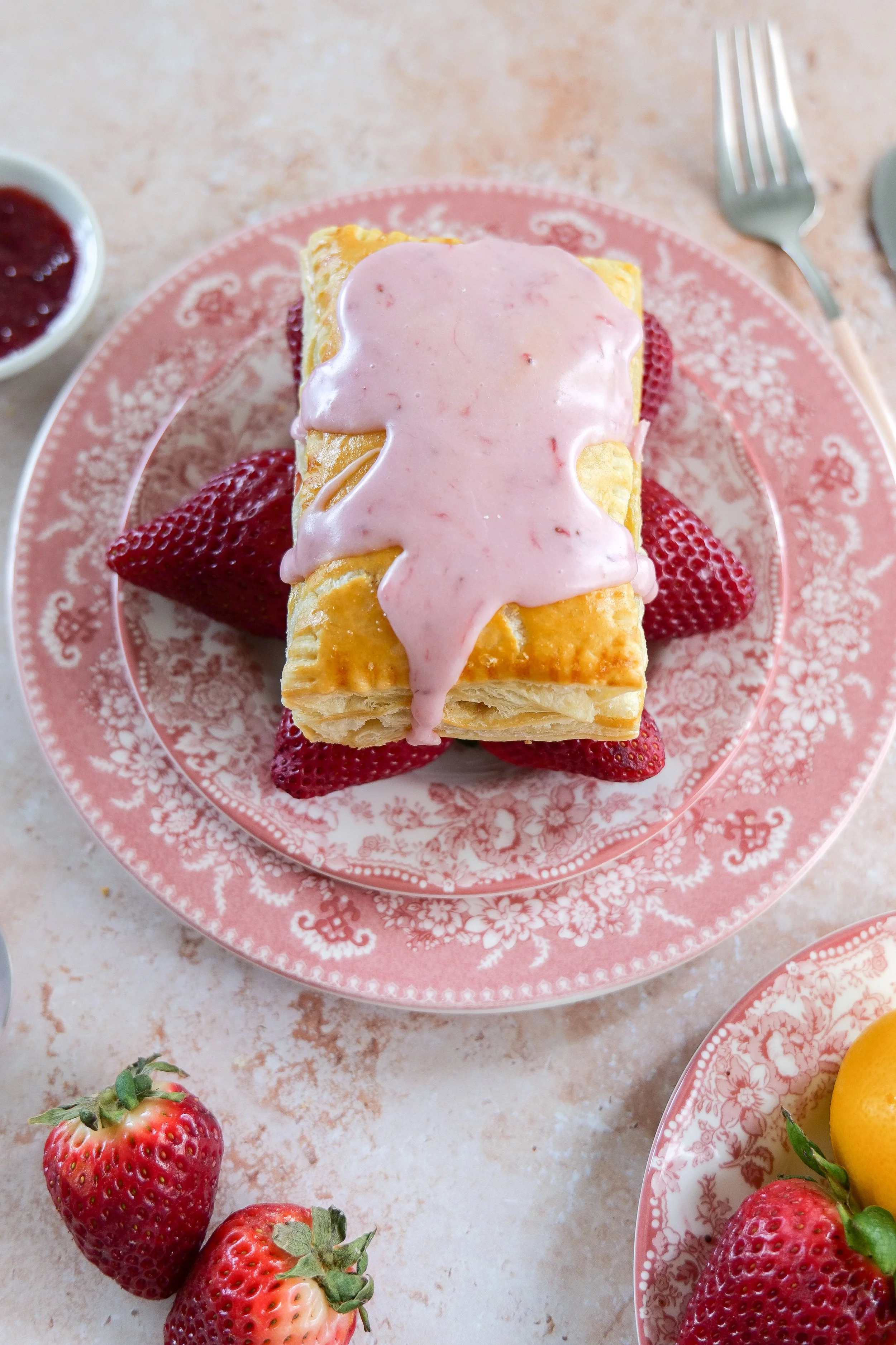 Strawberry Puff Pastry Pop Tart on a serving plate