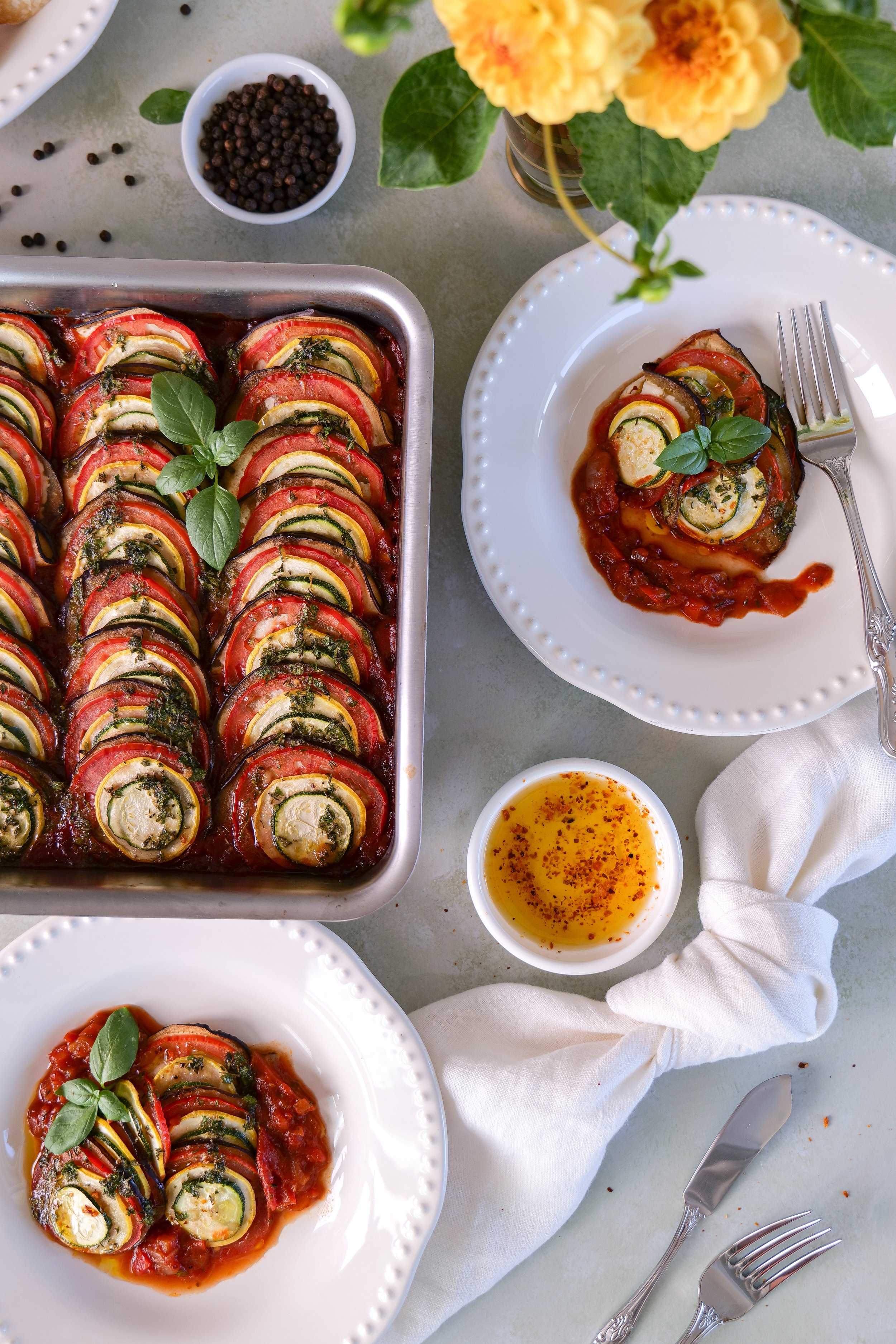 Beautiful table featuring homemade French ratatouille inspired by fresh farmers market produce.