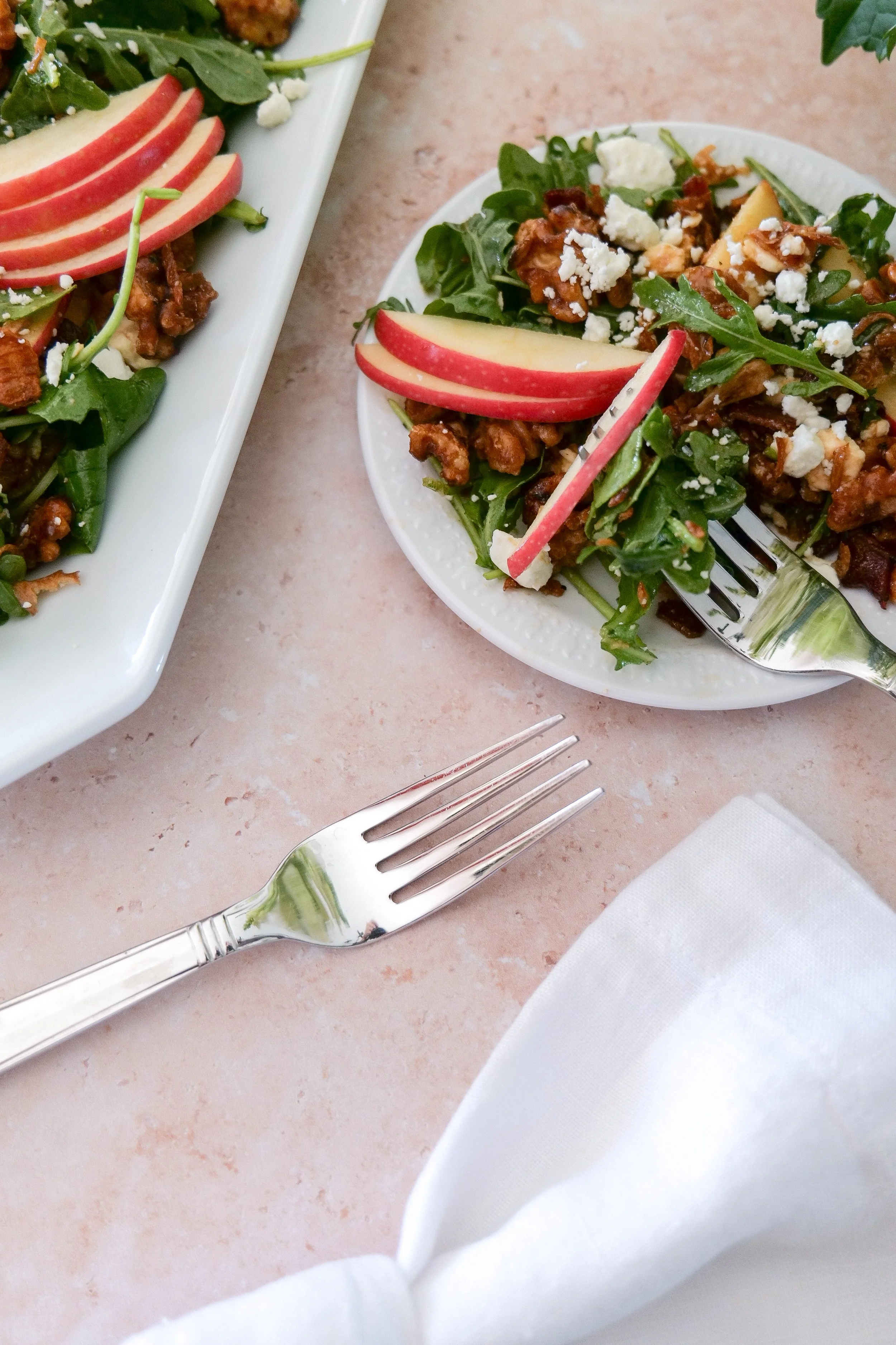 Maple bacon harvest salad with crisp apples, mixed greens, feta cheese and walnuts.