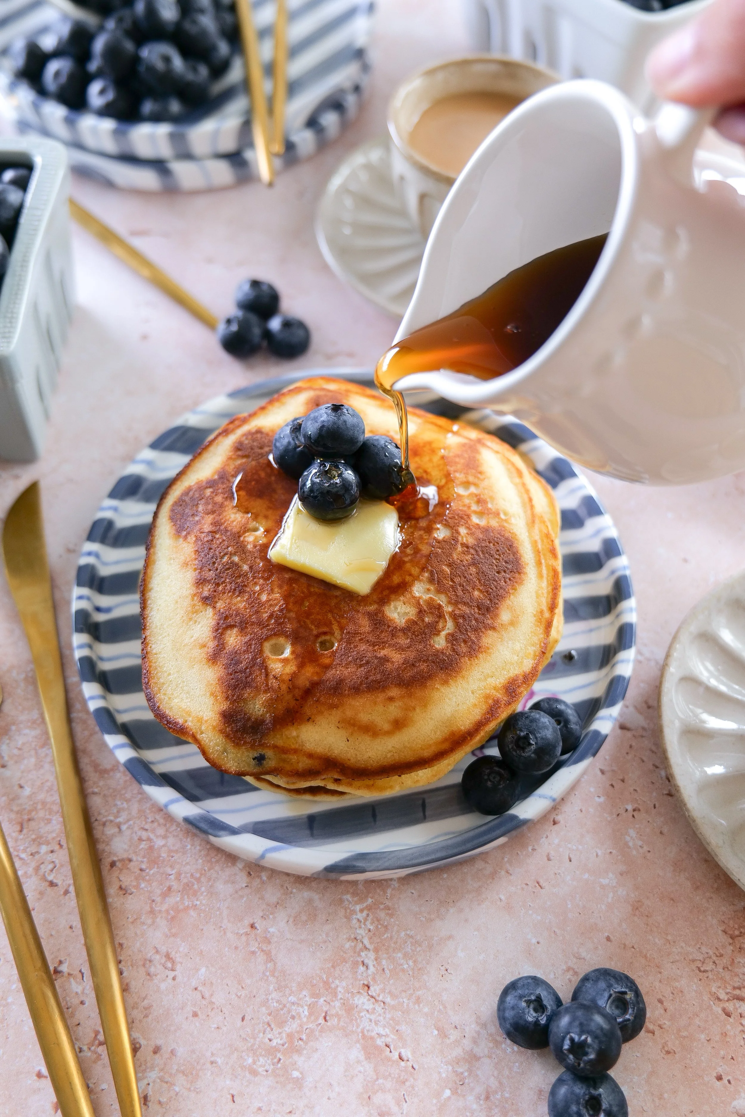 Homemade blueberry pancakes with sourdough discard and melted butter.