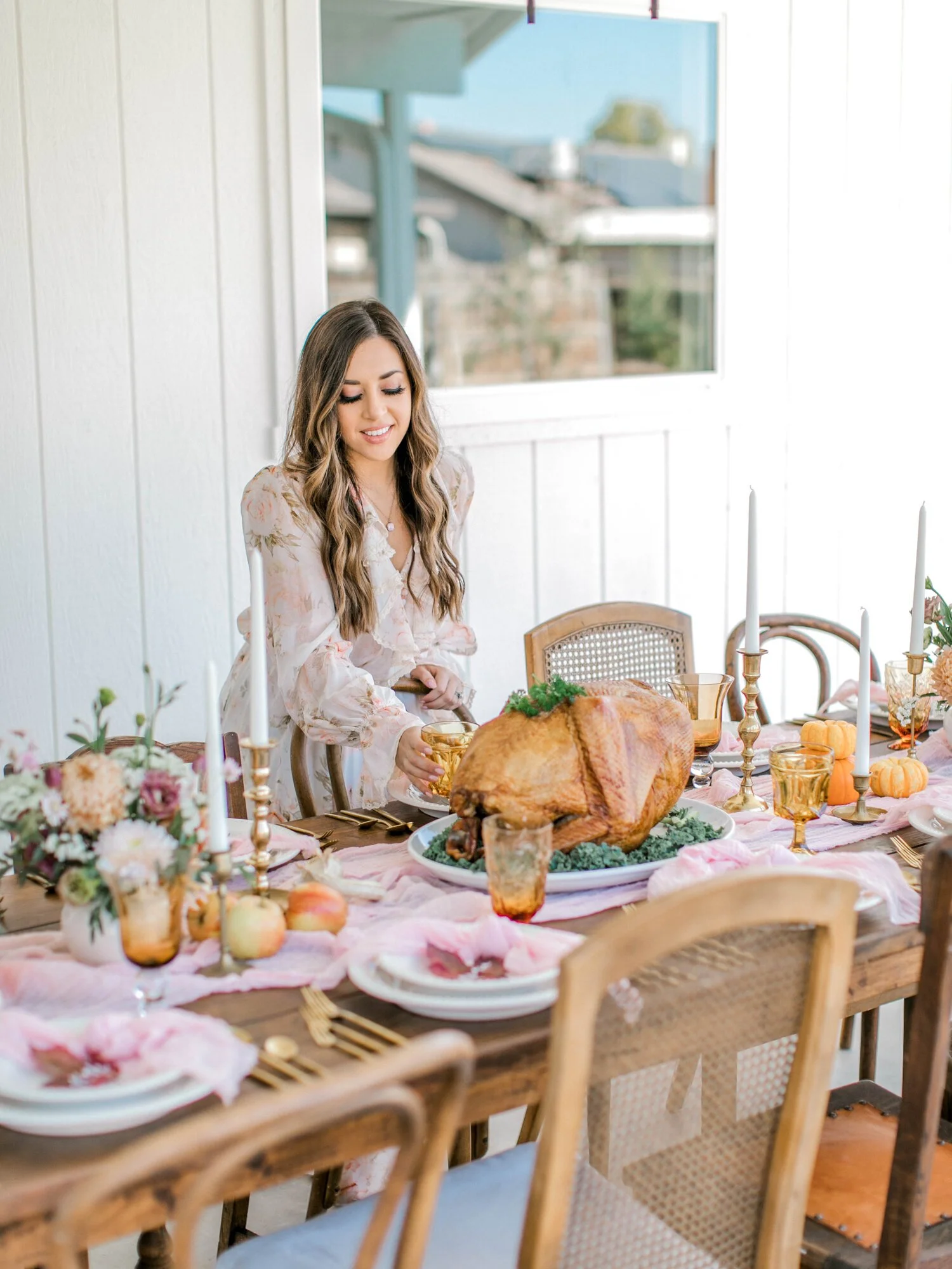 Friendsgiving tablescape decorated with seasonal fall produce