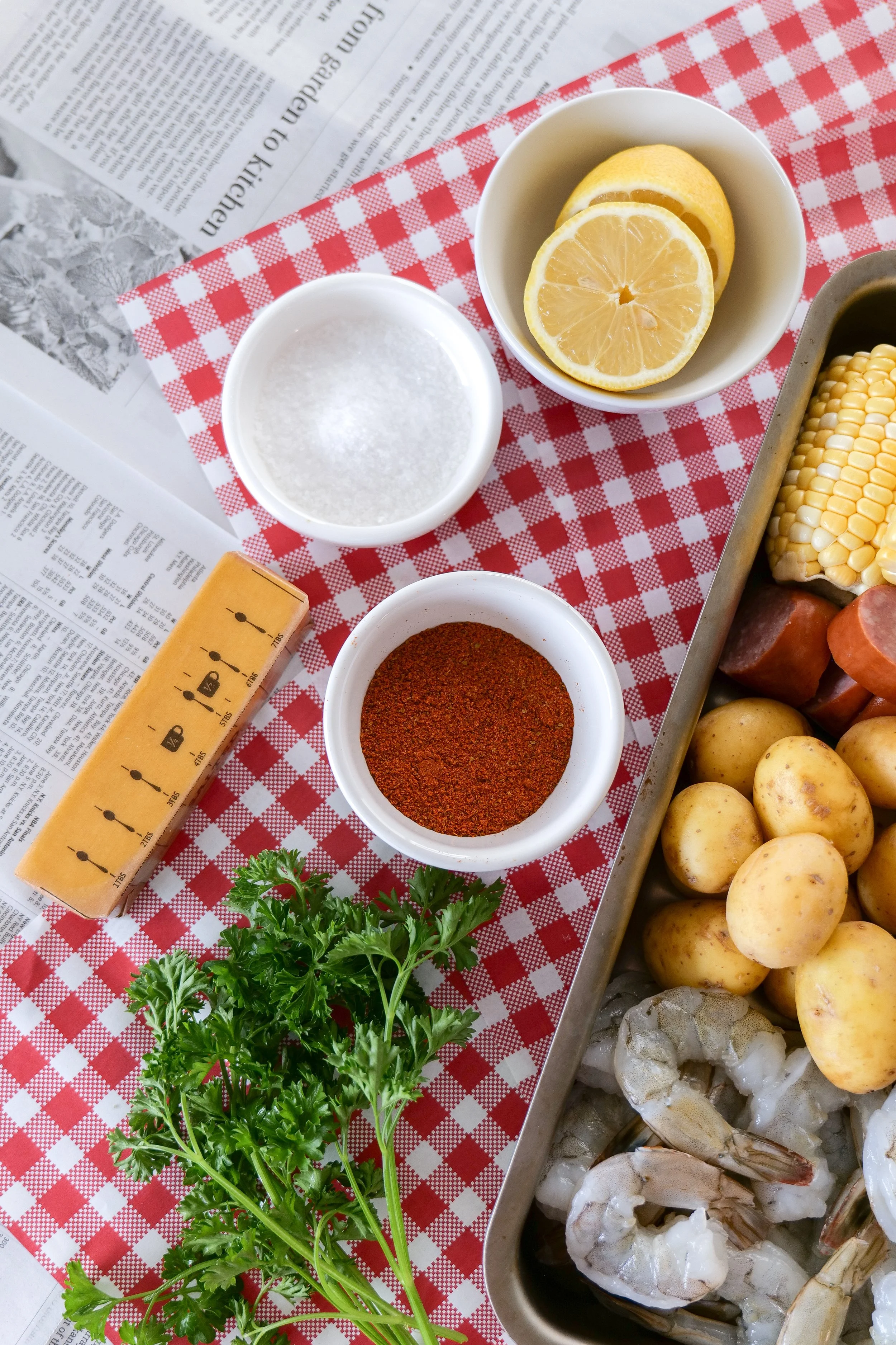 Homemade seafood boil recipe featuring shrimp, potatoes, corn, and smoked sausage.