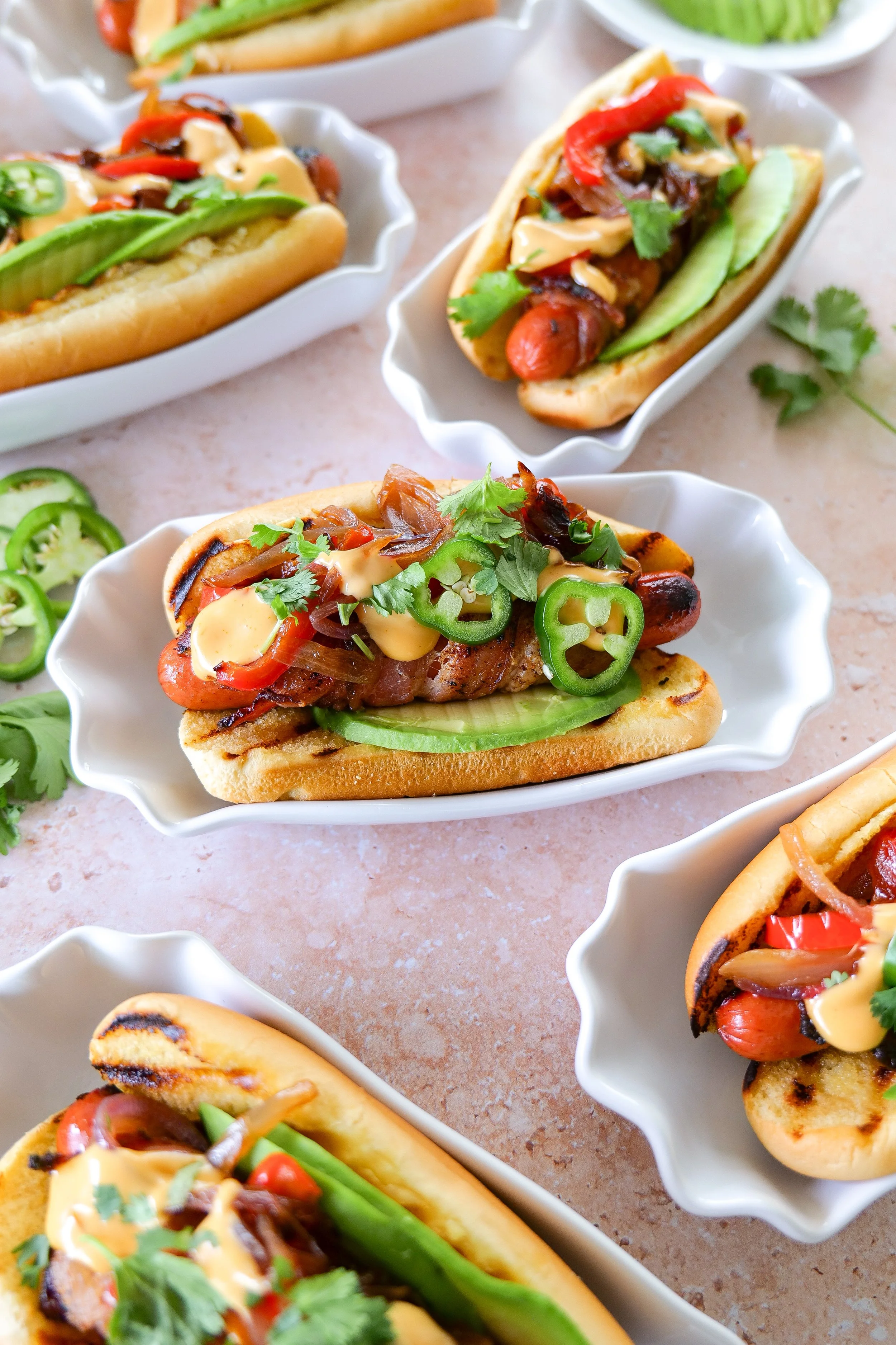 Holiday cookout food including bacon-wrapped hot dogs