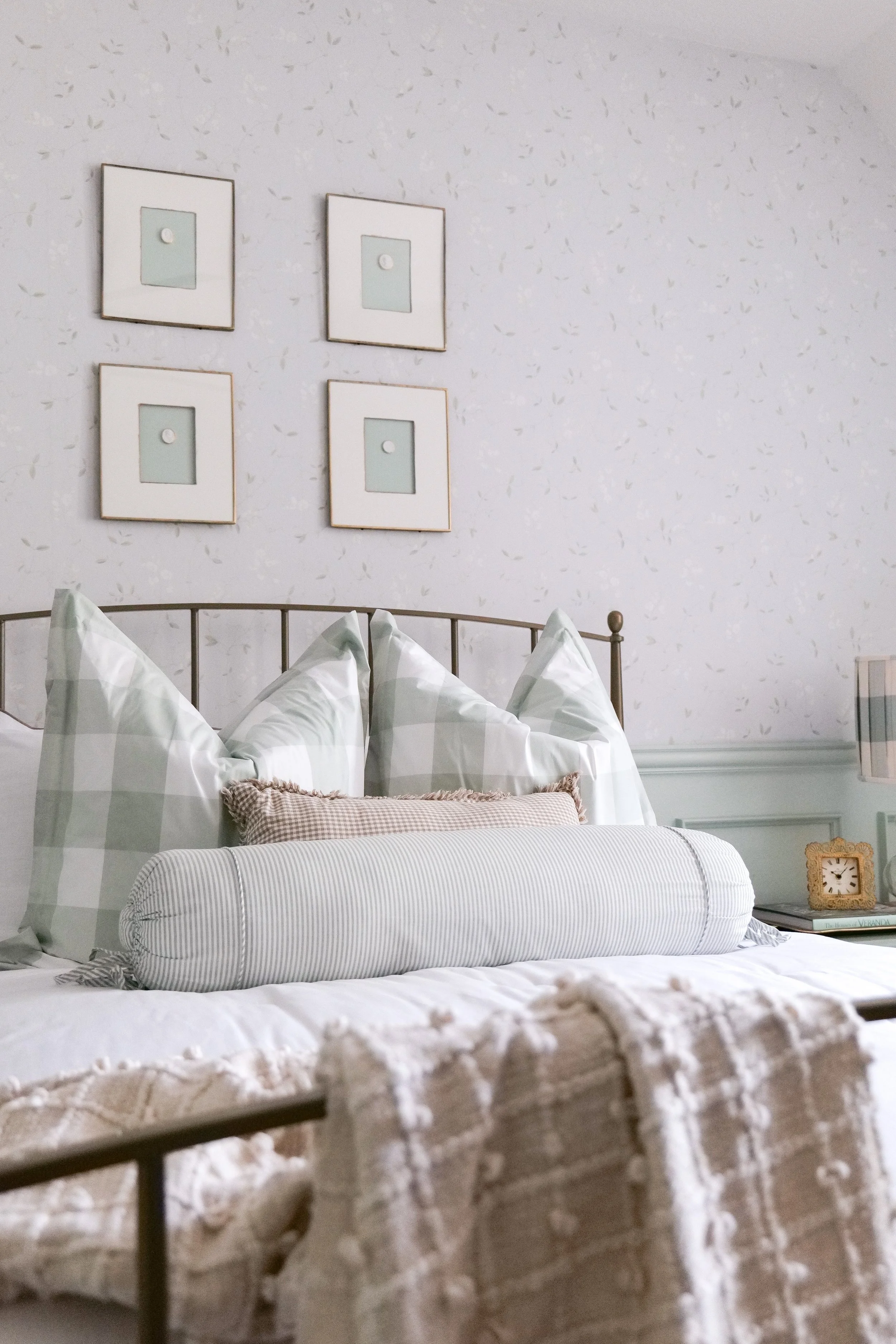 Traditional blue guest bedroom remodel with timeless elegant design and layered bedding.