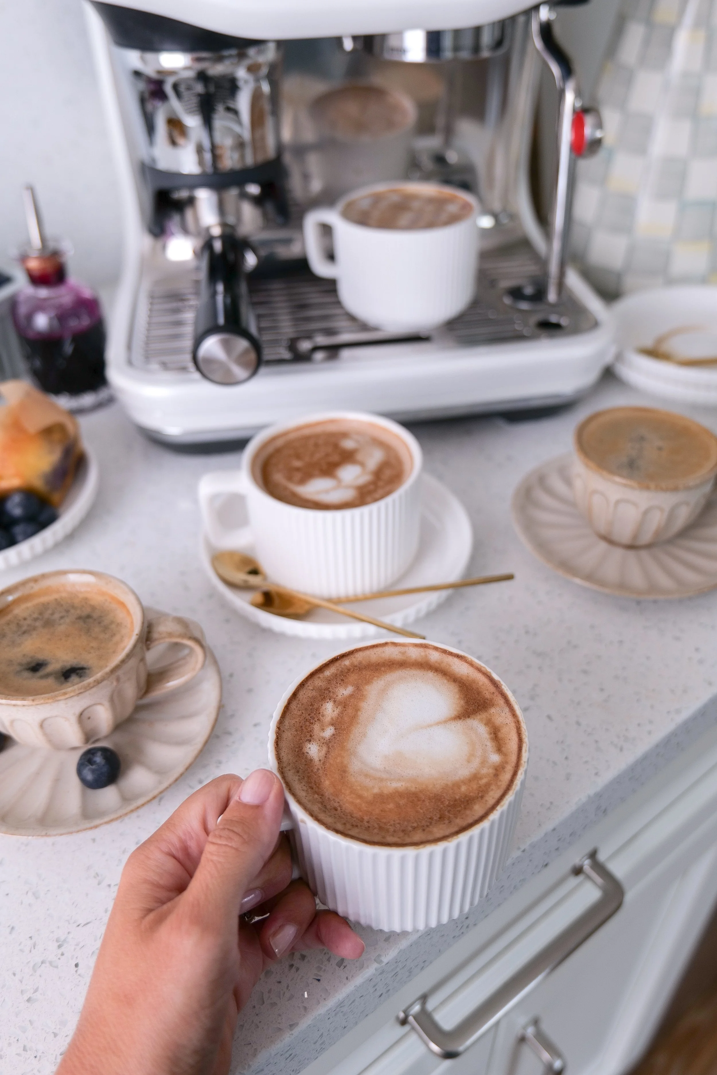 Cozy breakfast featuring a homemade Blueberry Muffin Latte, fresh blueberries, and bakery-style muffins.