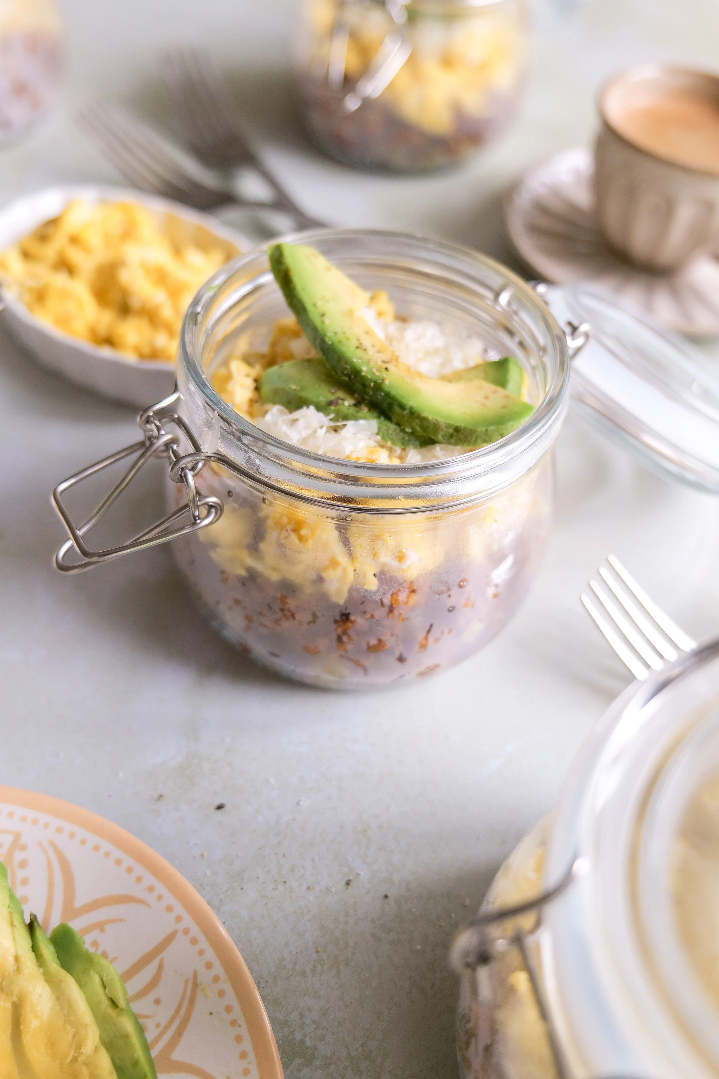Easy savory breakfast bowl layered with crispy potatoes, chorizo, scrambled eggs, cheese and avocado.