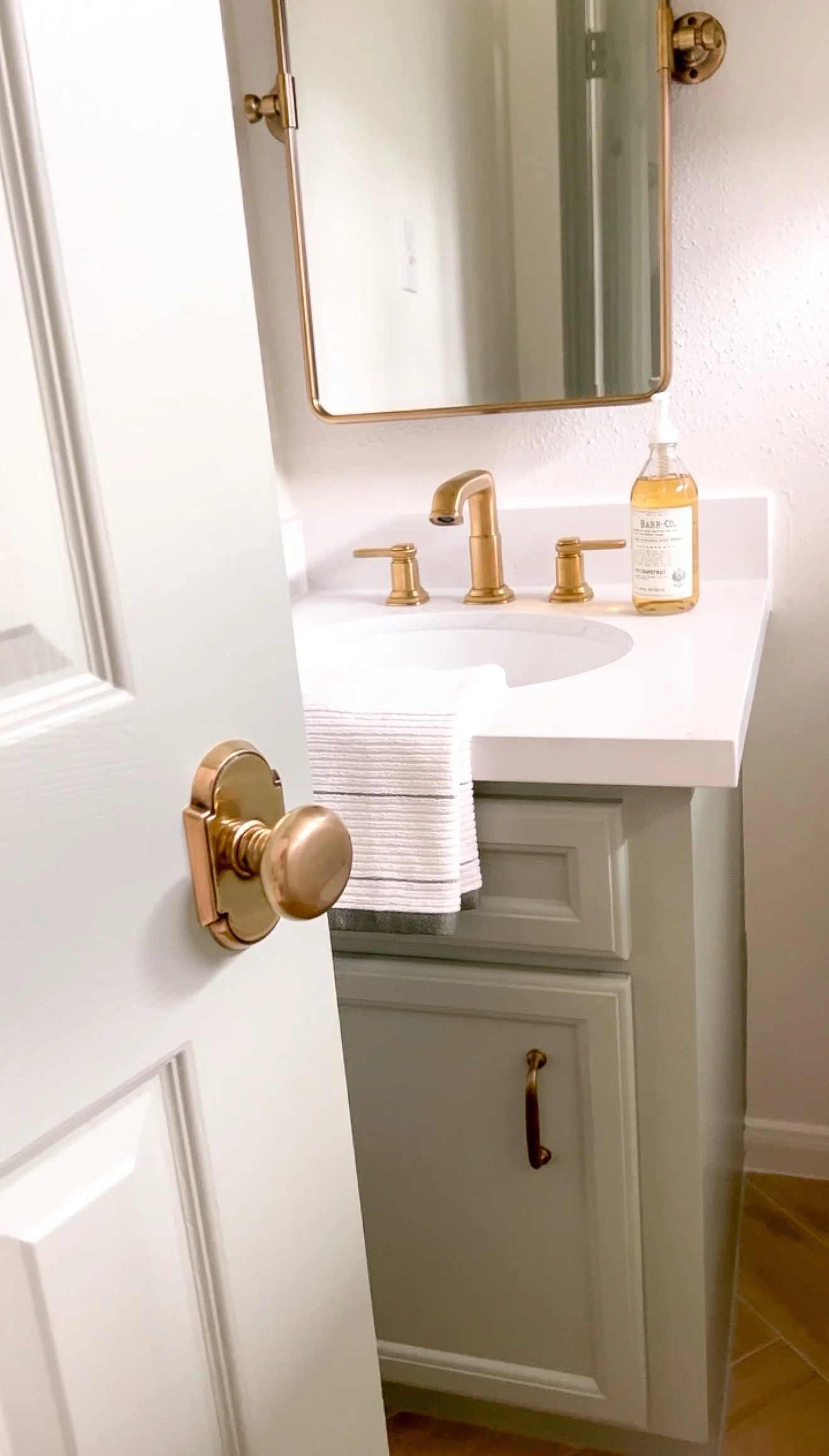 Interior home renovation highlighting the impact of upgraded hardware and thoughtful design details.