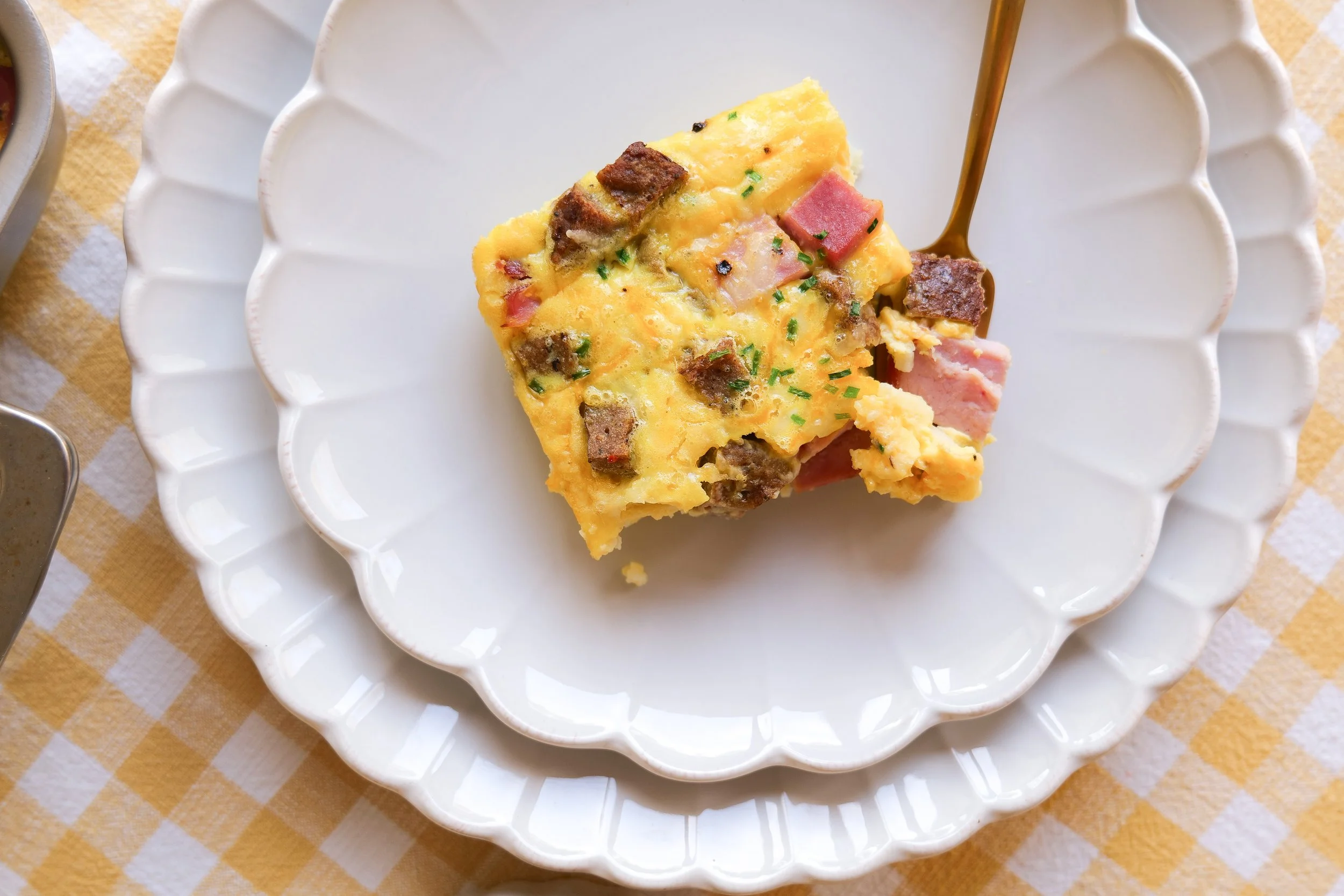 Cheesy hash brown casserole with eggs and breakfast sausage.