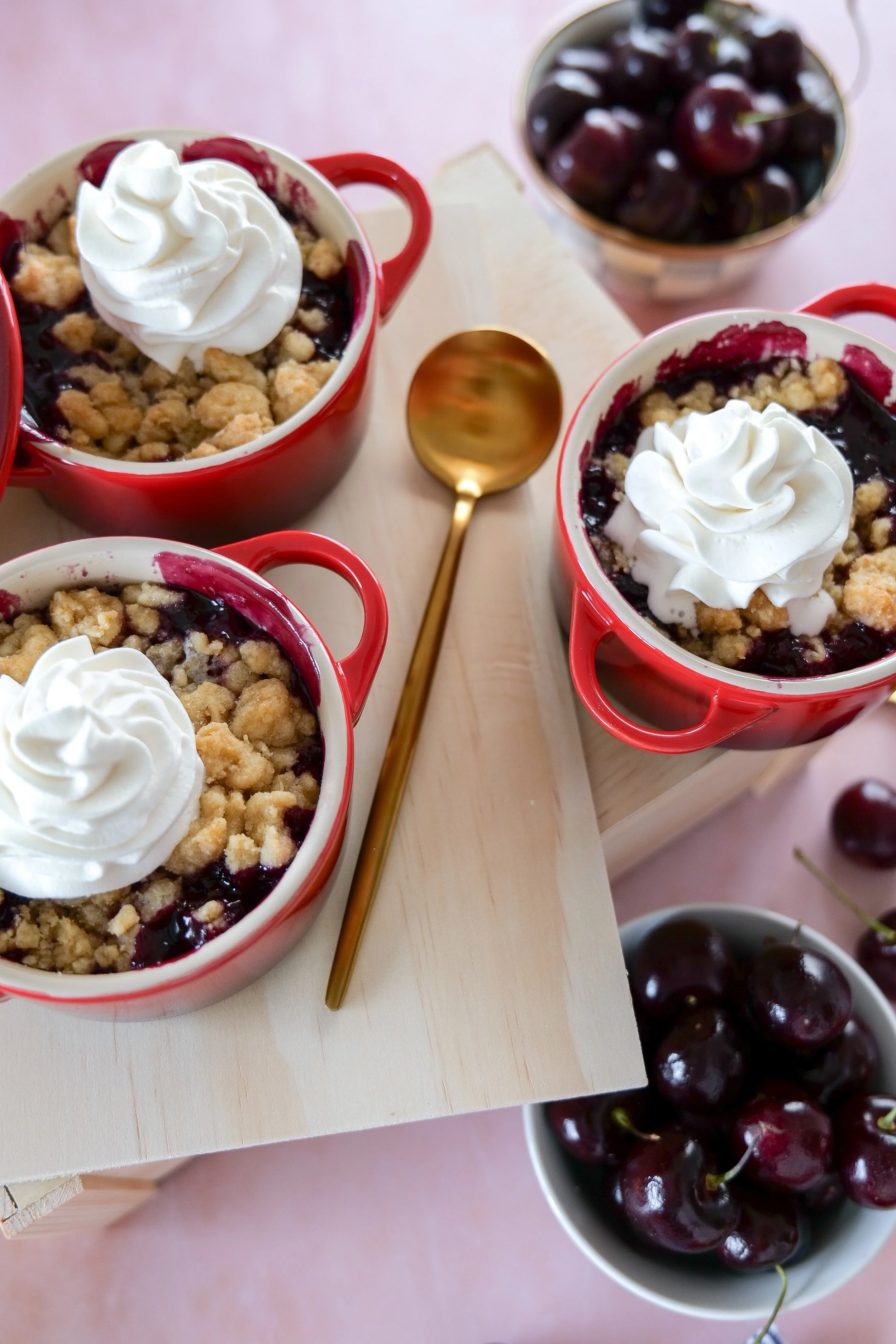 Individual cherry cobblers topped with golden brown crust