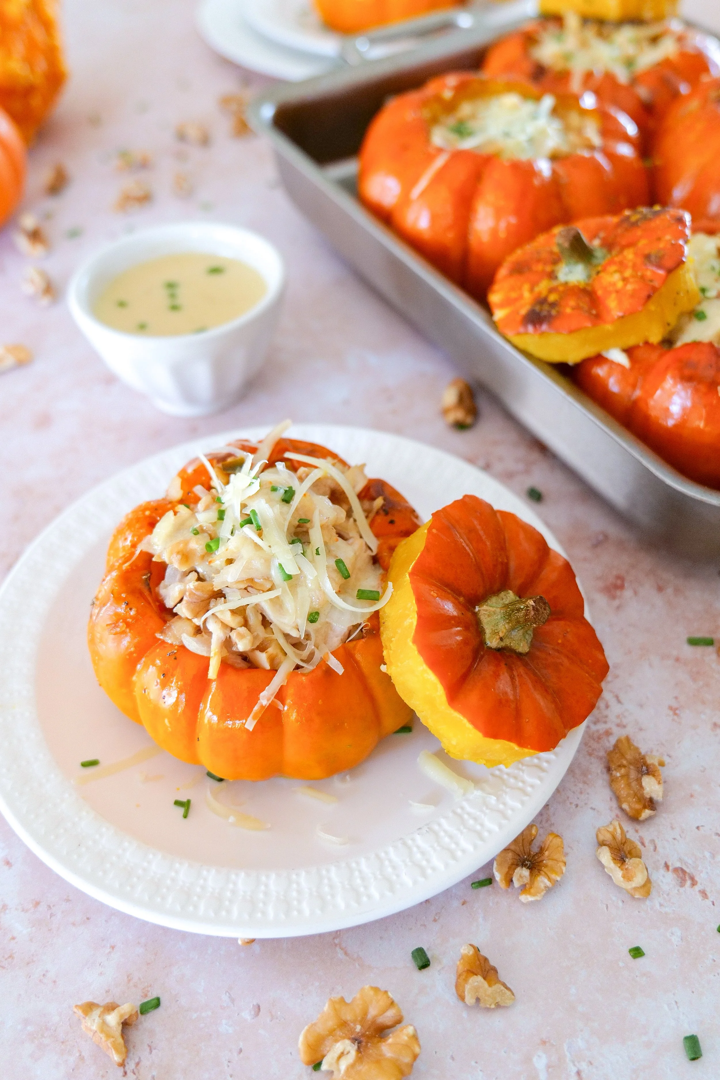 Walnut chicken stuffed pumpkin with tender roasted pumpkin and creamy Gruyère filling.