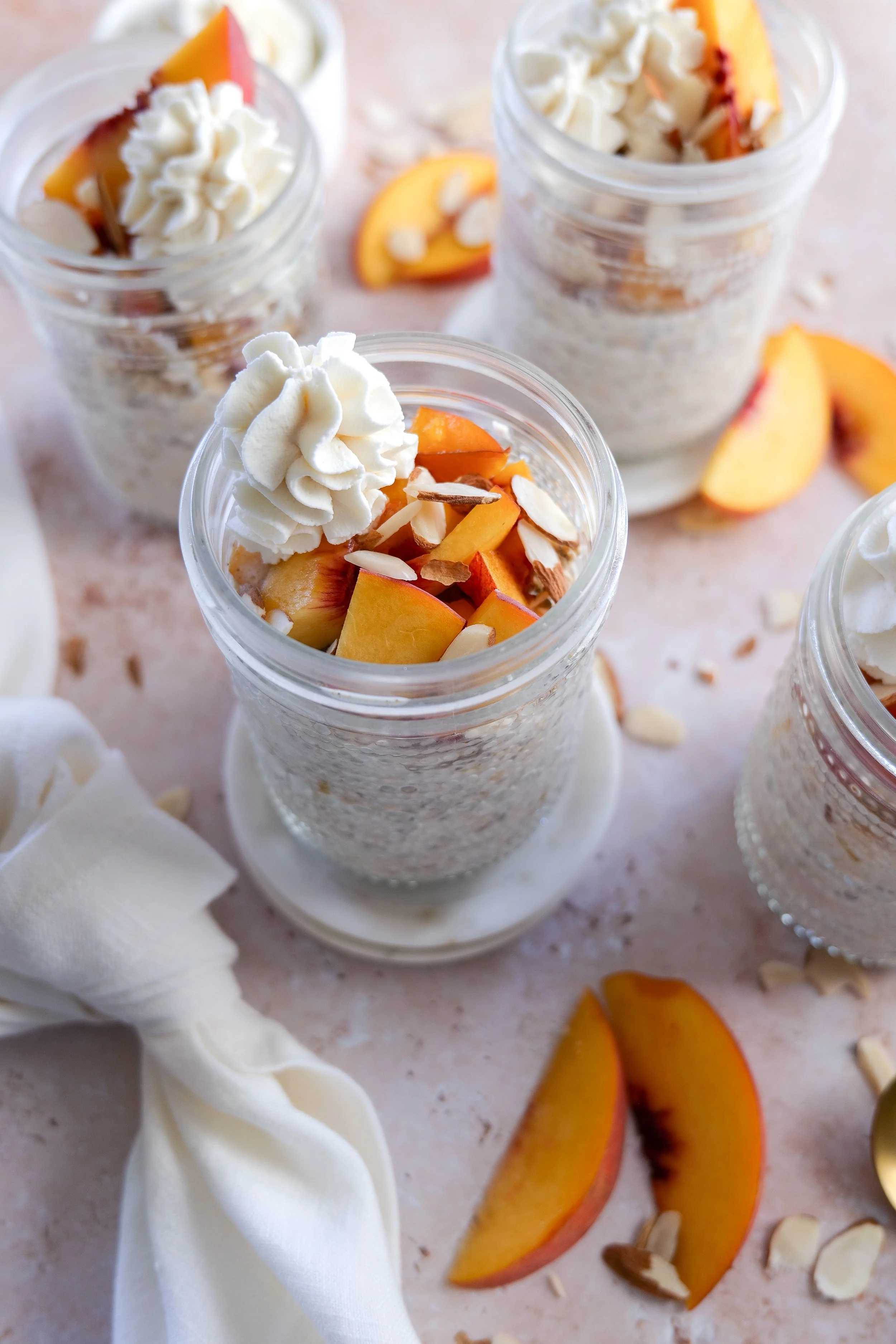 Creamy overnight oats with fresh peaches and warm cinnamon flavors.