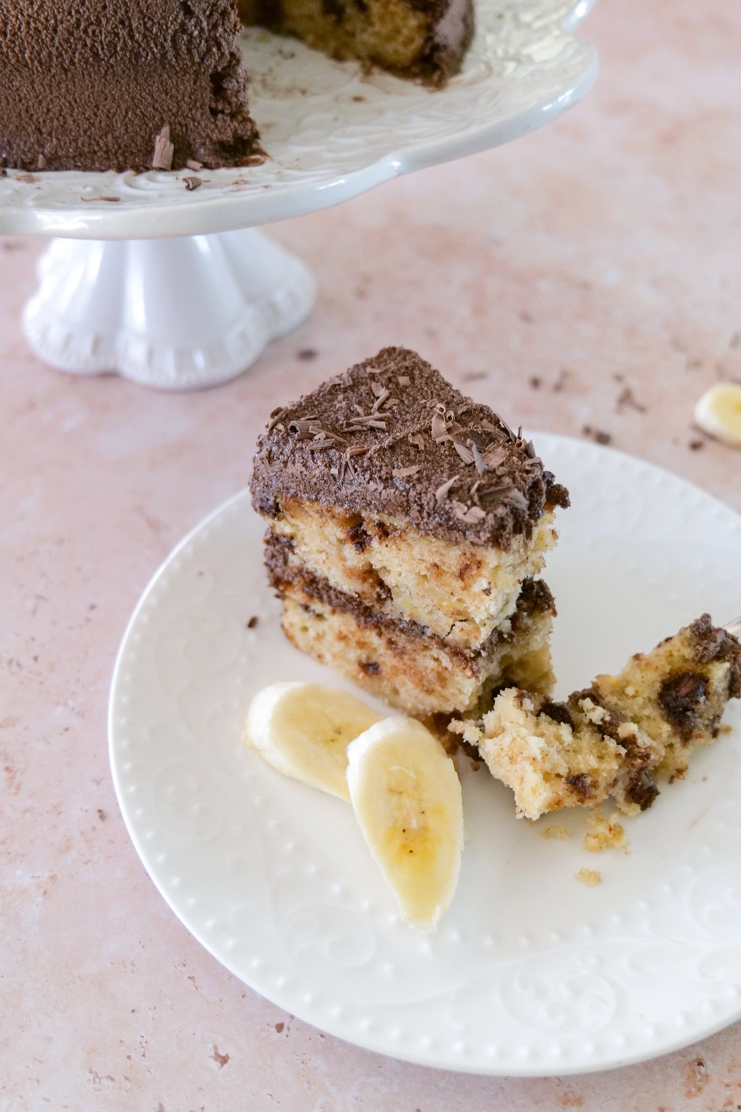 Banana chocolate chip cake layered and frosted with whipped chocolate ganache.