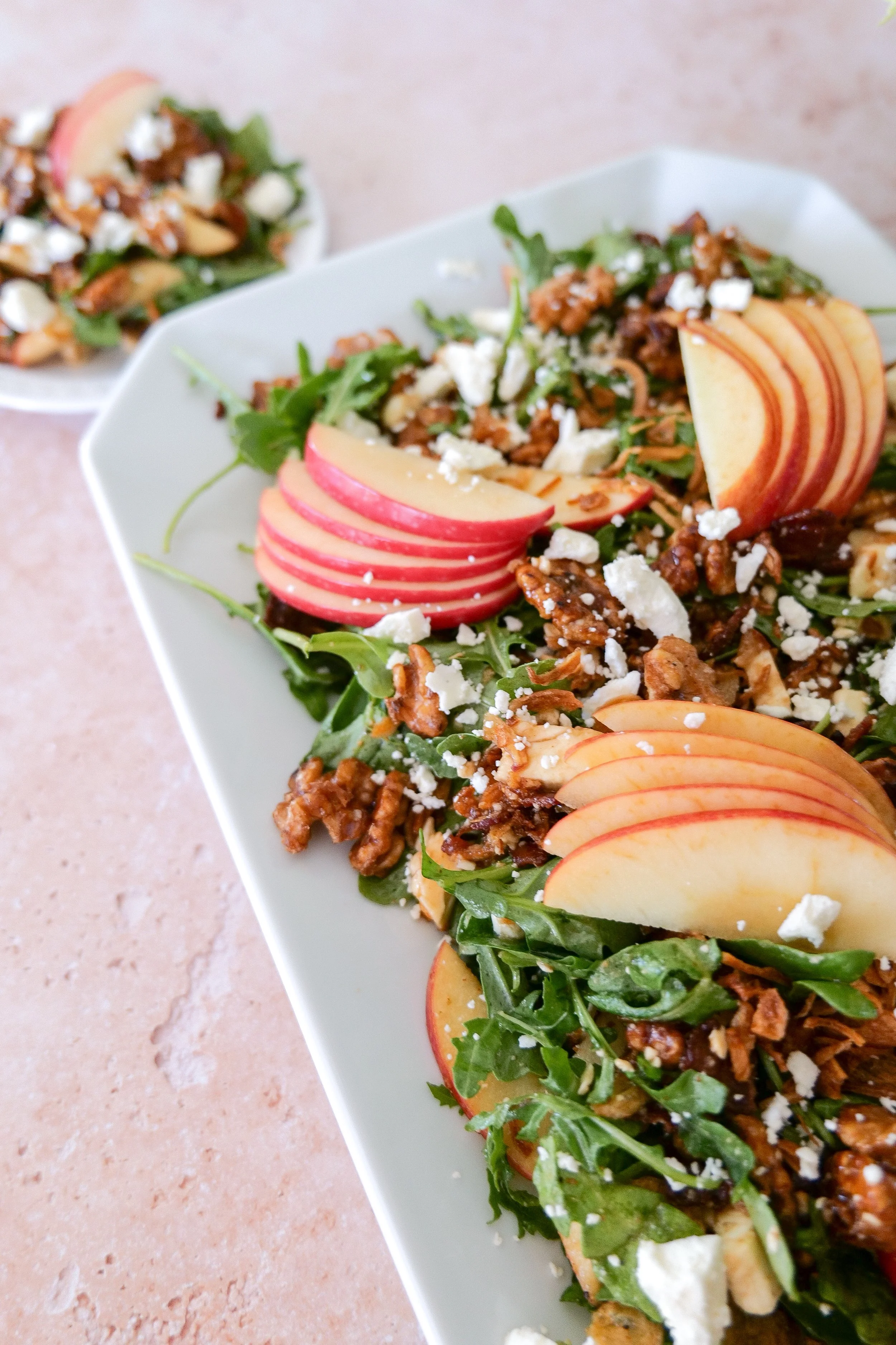 Fall salad finished with crispy shallots, apples, bacon, feta and maple walnuts.