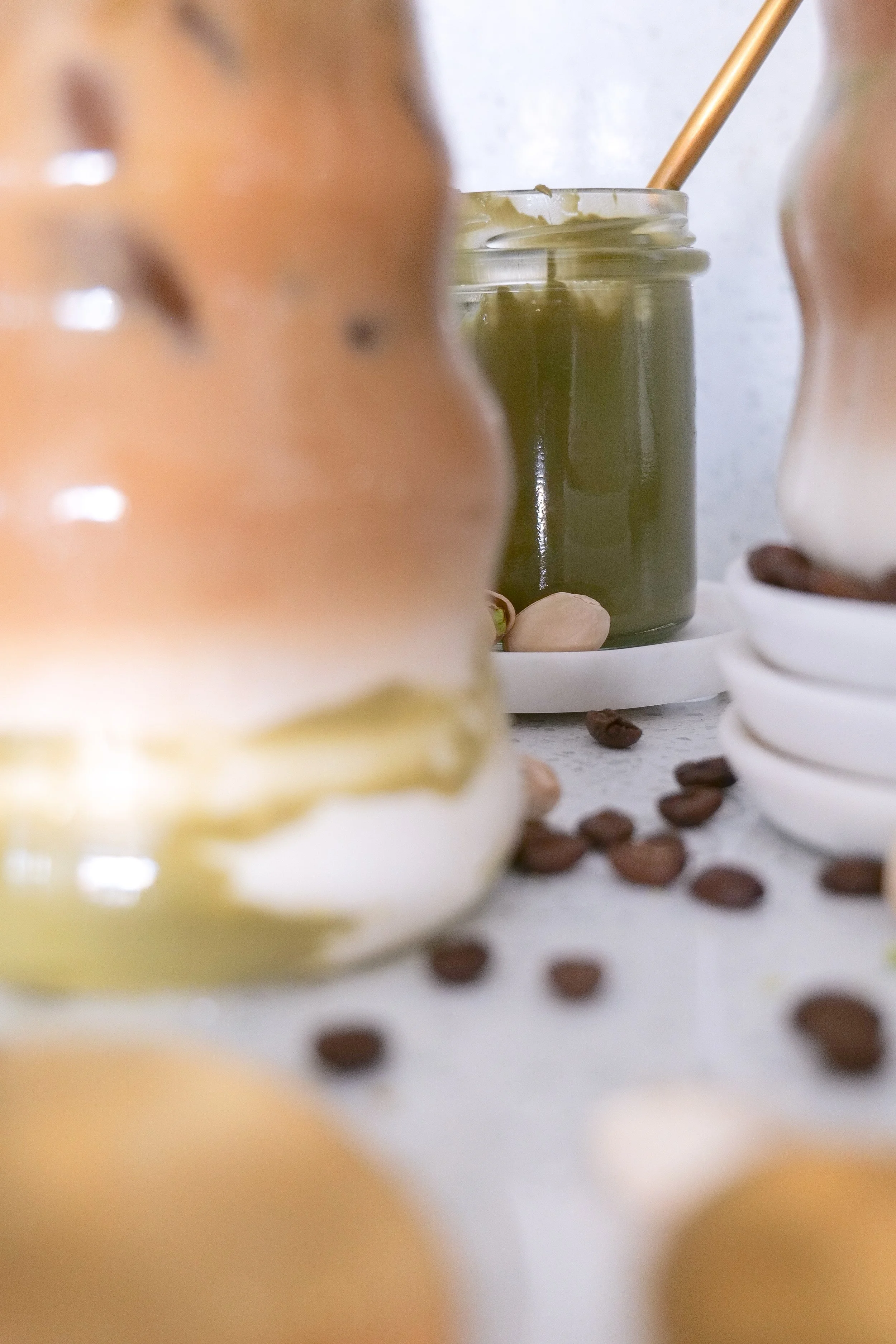 Pistachio espresso latte with creamy milk and rich pistachio flavor served over ice.
