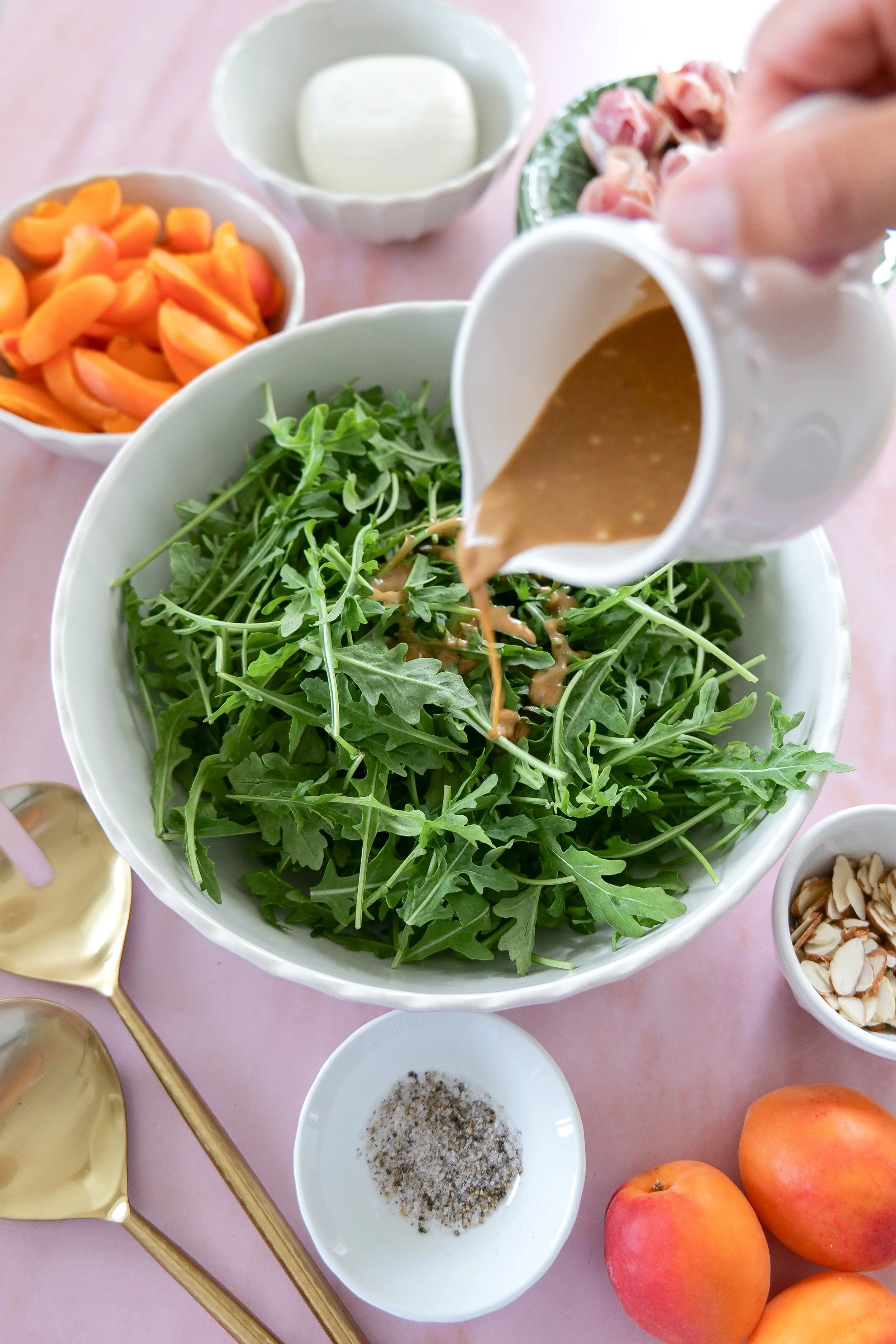 Fresh summer apricot salad with creamy burrata and arugula.