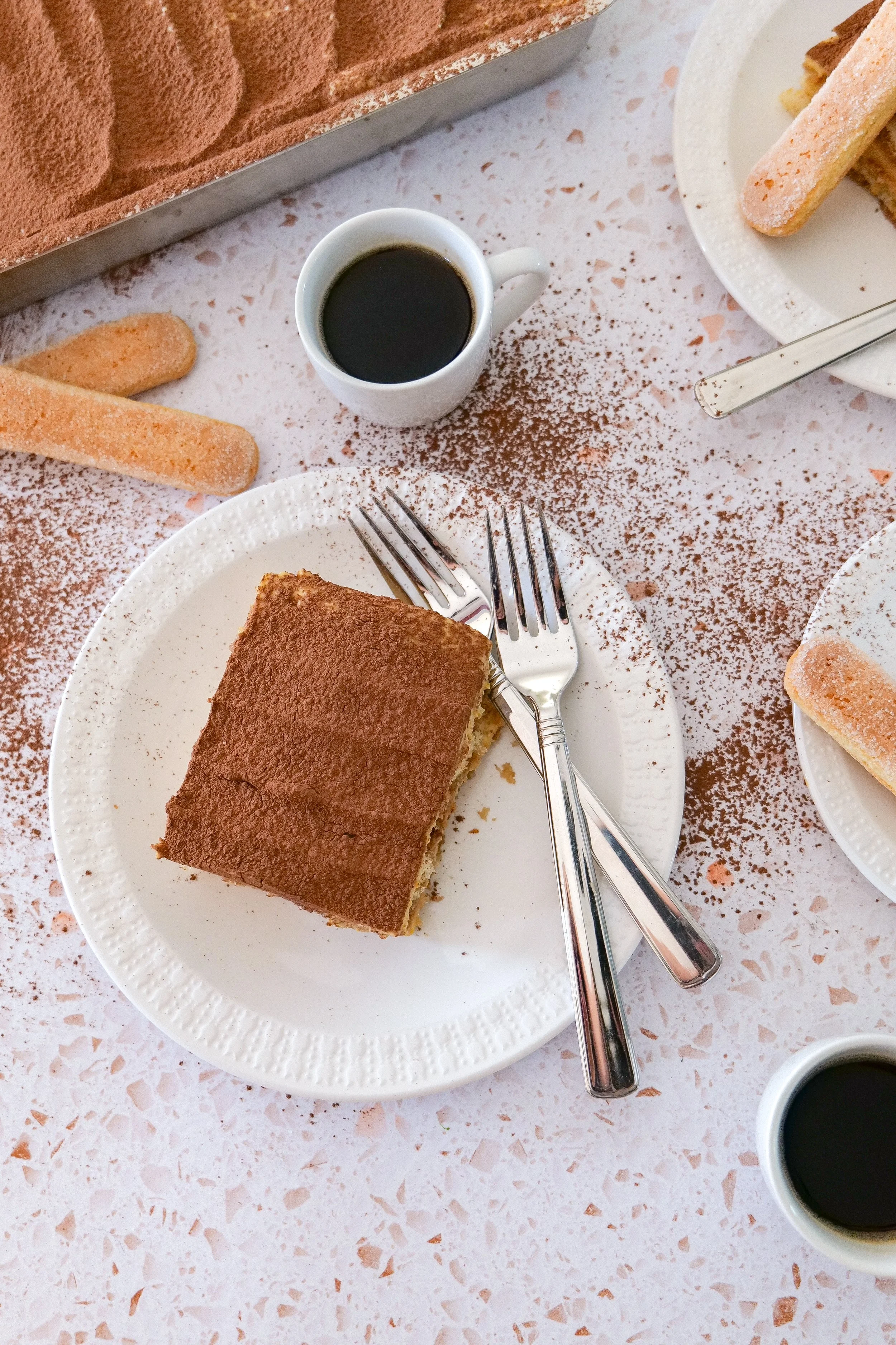 Creamy pumpkin tiramisu served as a fall dessert with cocoa and pumpkin spice.