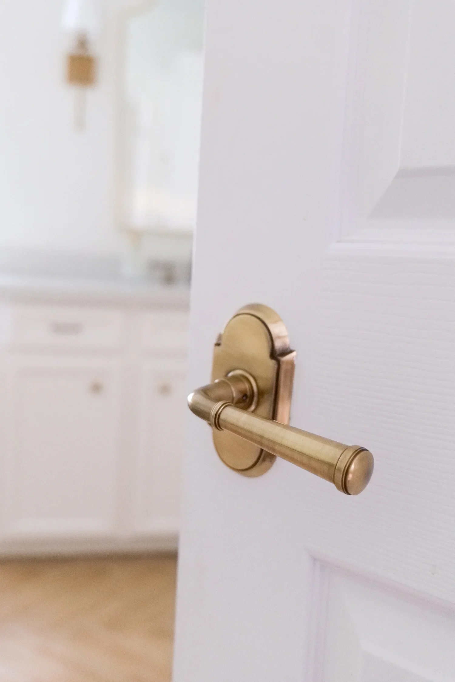 Close-up of antique brass interior door hardware in a traditional home.
