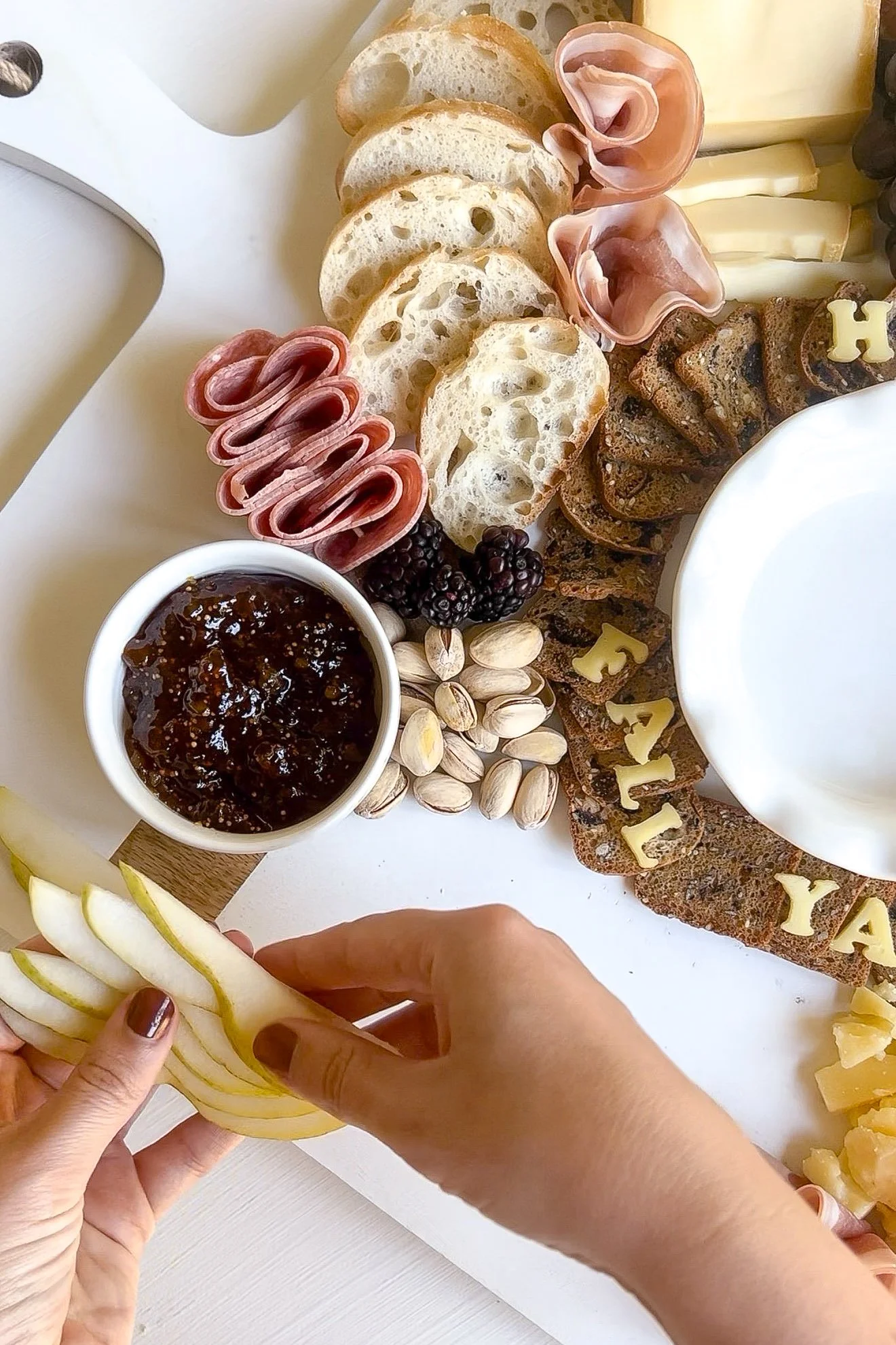Fall charcuterie board with fig jam baked Brie