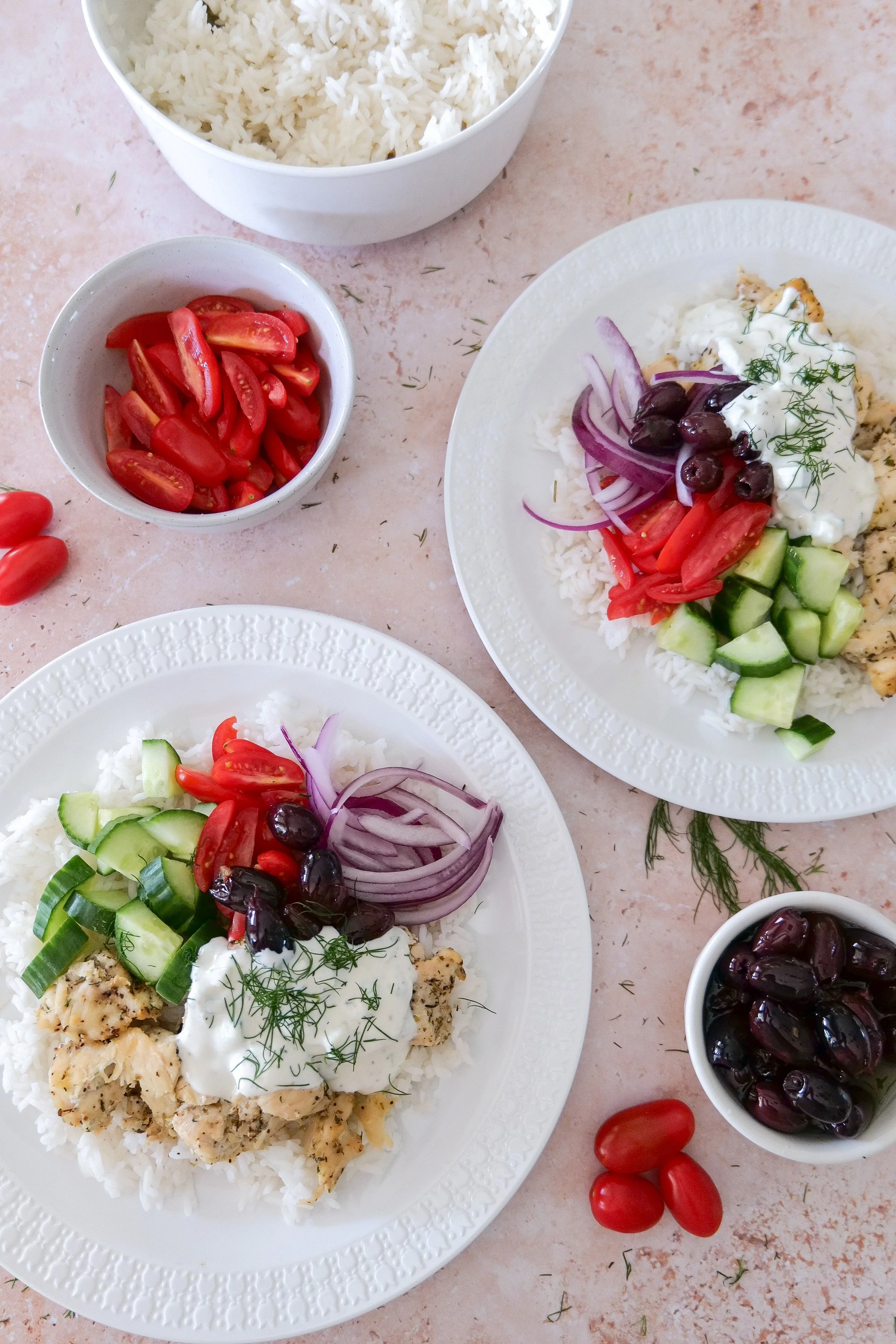 Easy Greek-inspired chicken rice bowl with fresh vegetables and creamy cucumber-dill tzatziki.