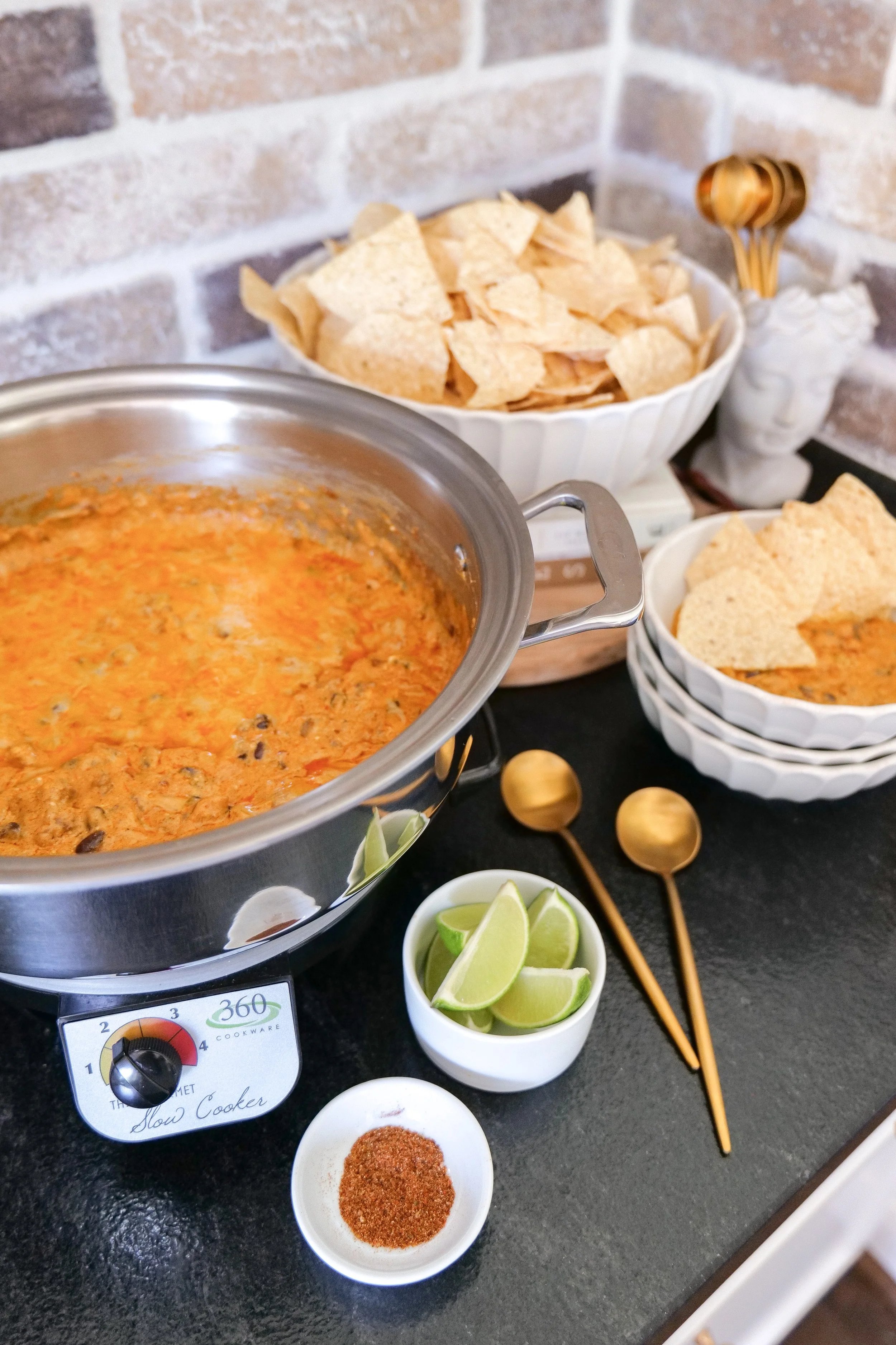 Warm cheesy chicken enchilada dip ready to serve as an easy party appetizer.